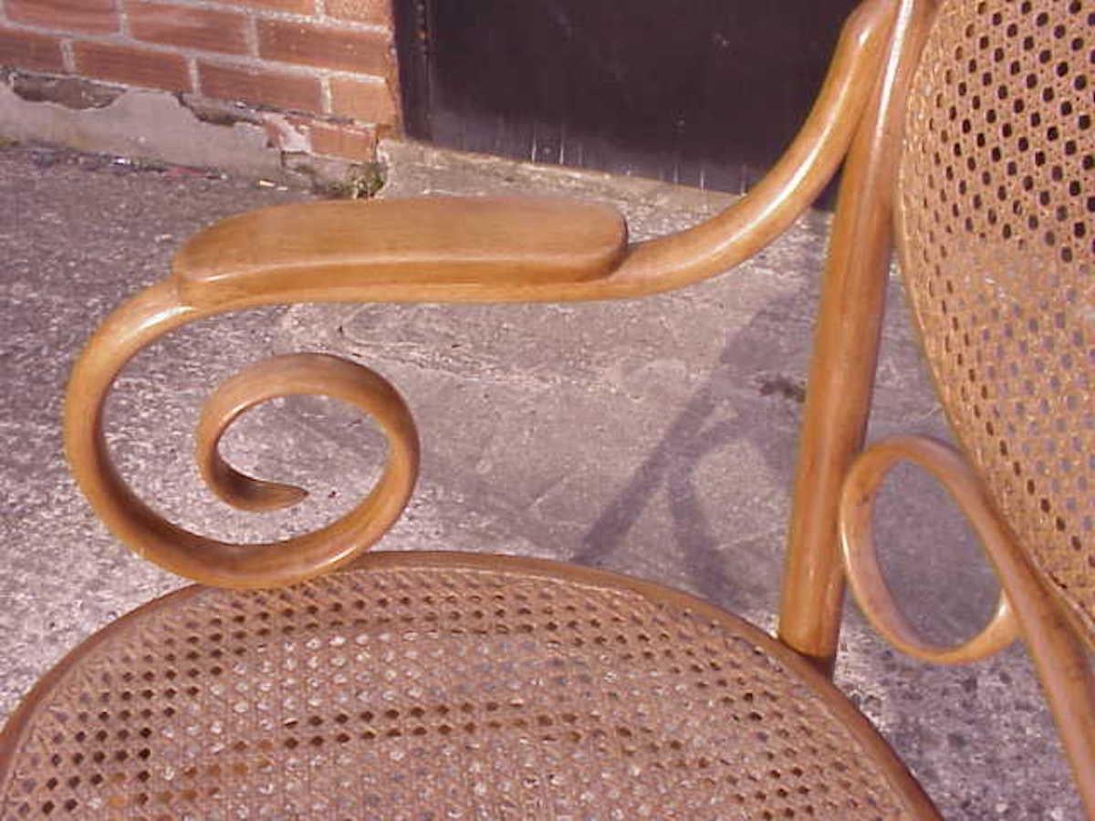 Thonet, A Bentwood Settee with Scrollwork Decoration with a Caned Seat & Back For Sale 1