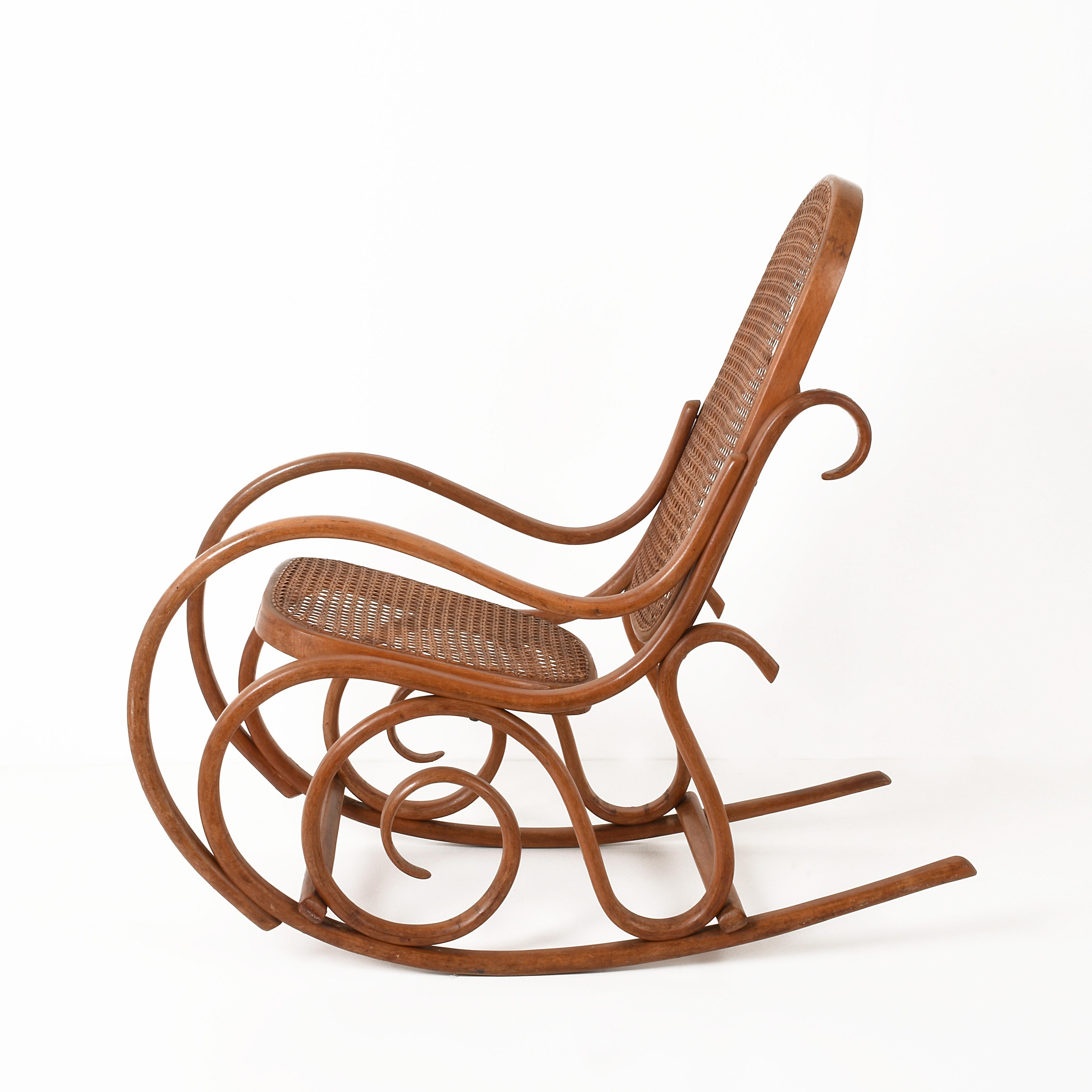 Other Thonet. A Vintage Bentwood Child's Rocking Chair with Cane Back and Seat, 1930s