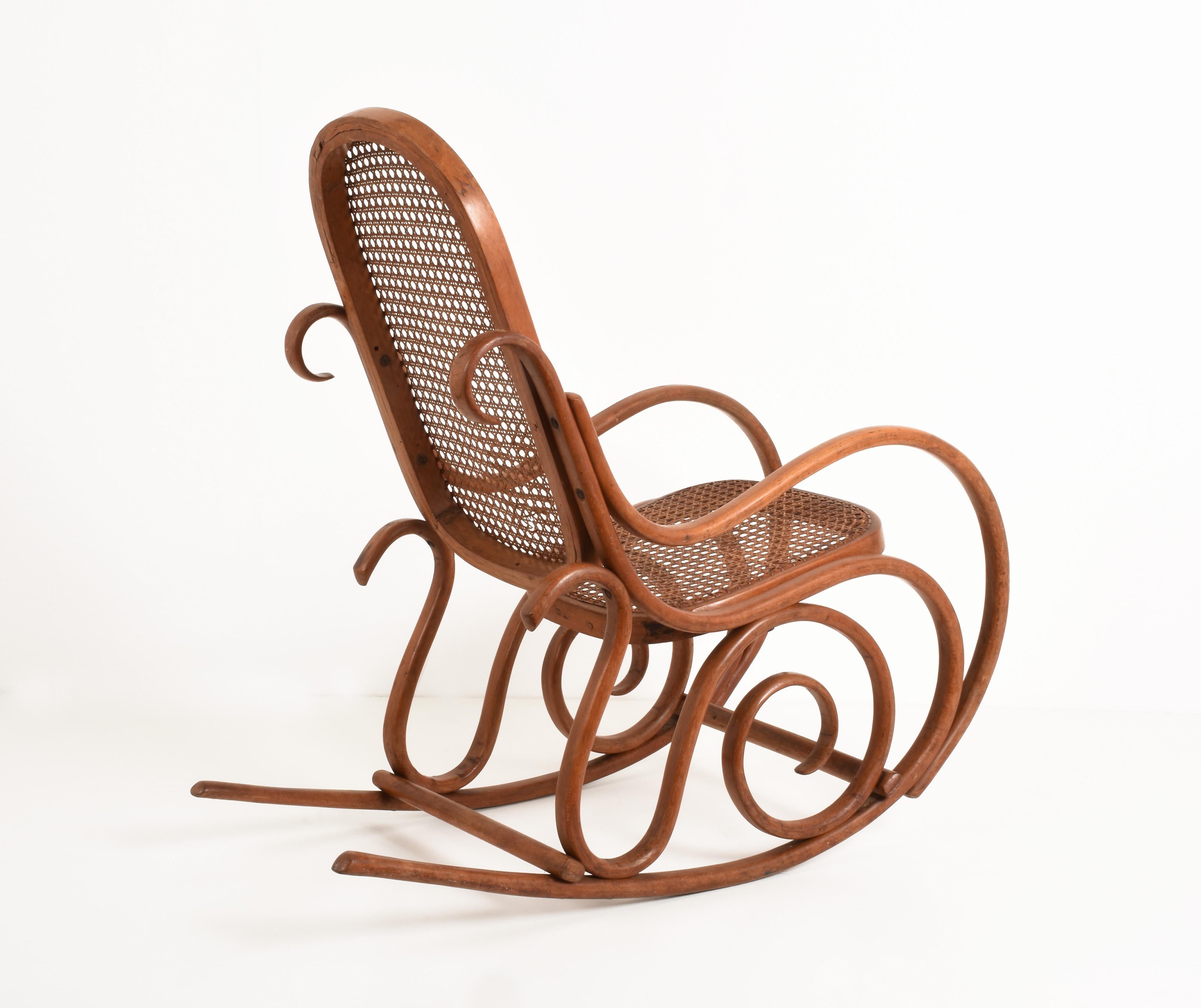 Italian Thonet. A Vintage Bentwood Child's Rocking Chair with Cane Back and Seat, 1930s