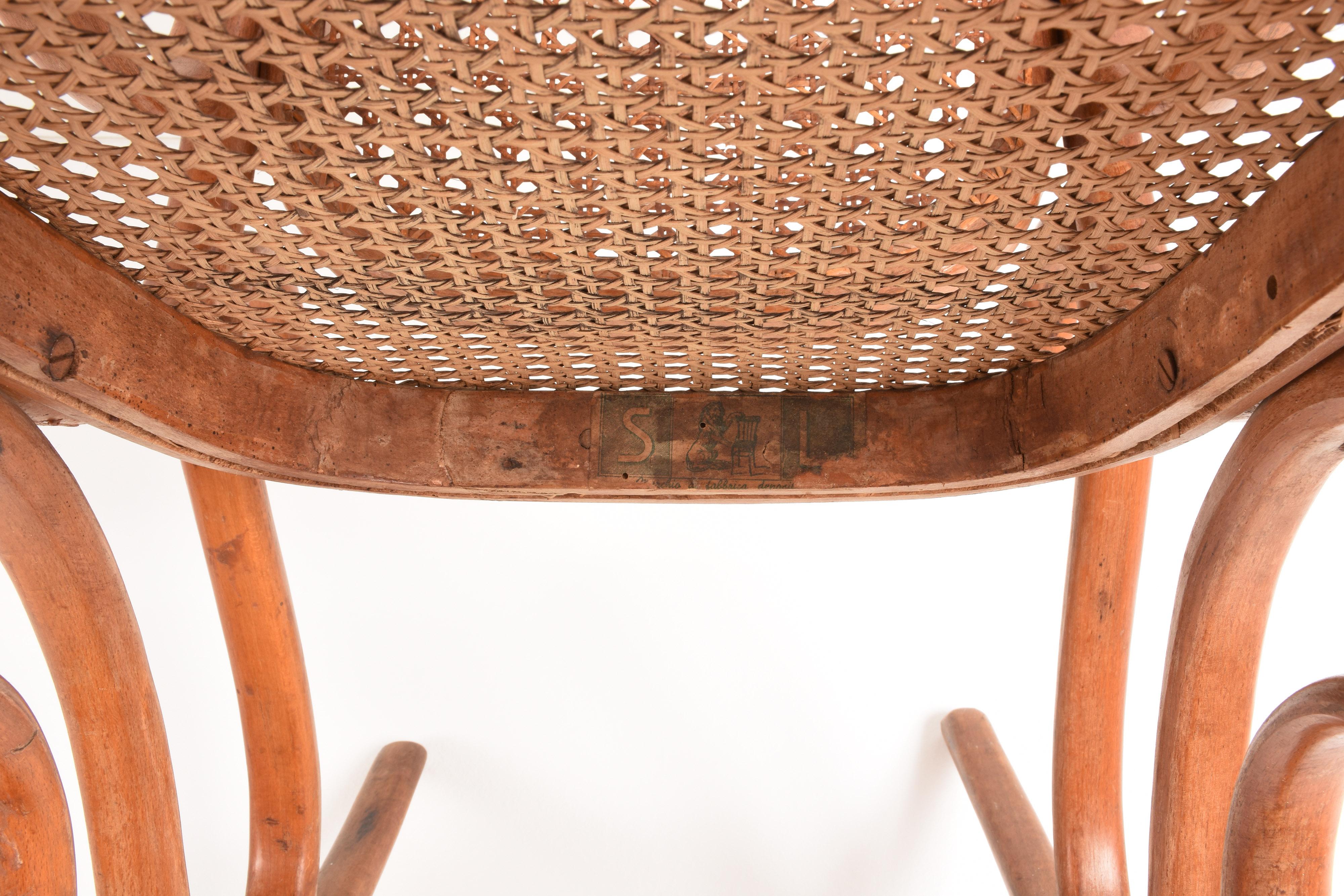 Thonet. A Vintage Bentwood Child's Rocking Chair with Cane Back and Seat, 1930s In Good Condition In Roma, IT