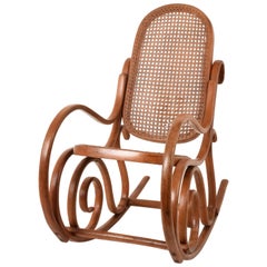 Thonet. A Vintage Bentwood Child's Rocking Chair with Cane Back and Seat, 1930s