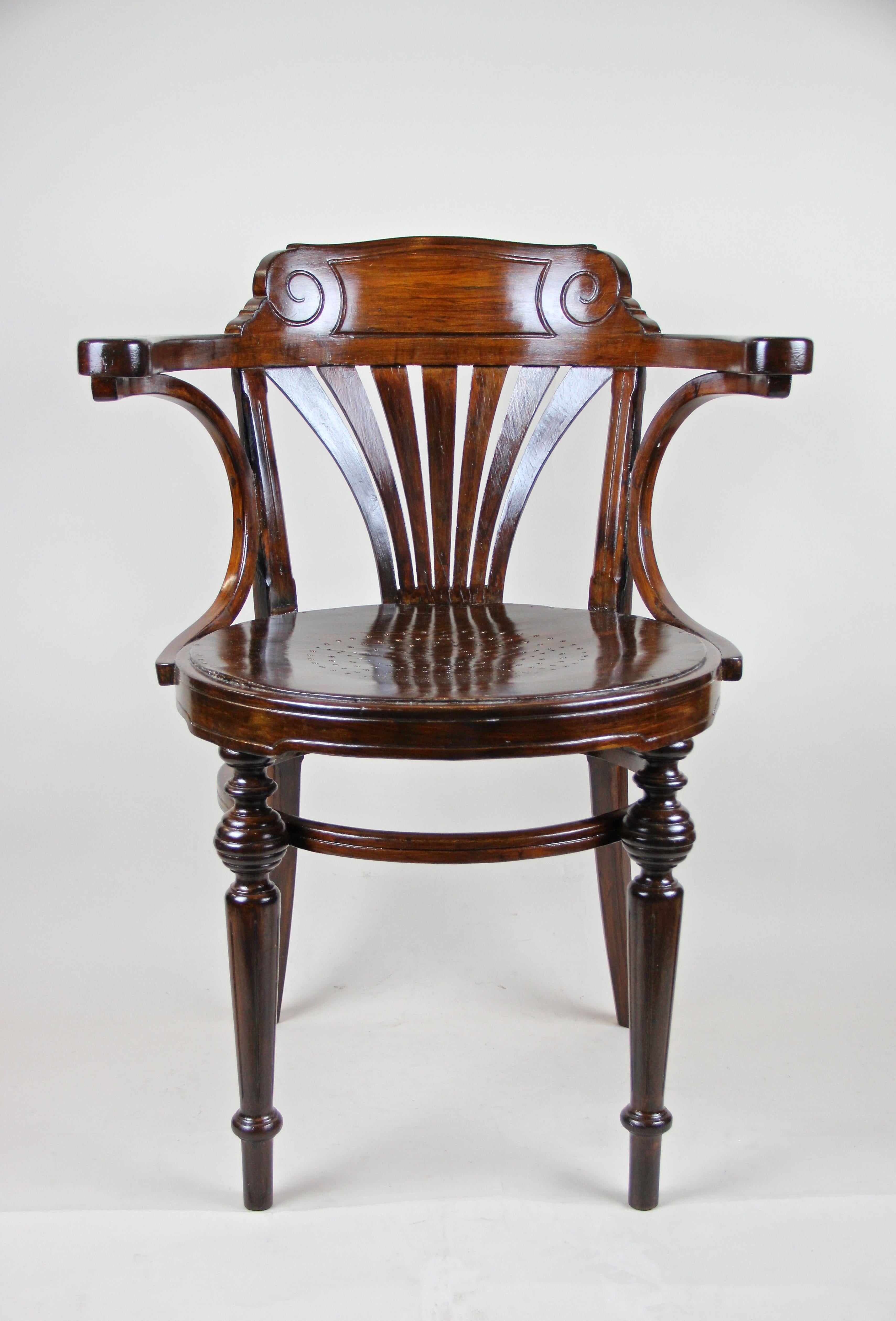 Beautifully restored rare Thonet Armchair from Austria, circa 1890. Made of bentwood, typical for these items, the round seat of this early Thonet chair is adorned by a great perforated star design. The wonderful carved backrest is highlighted by a