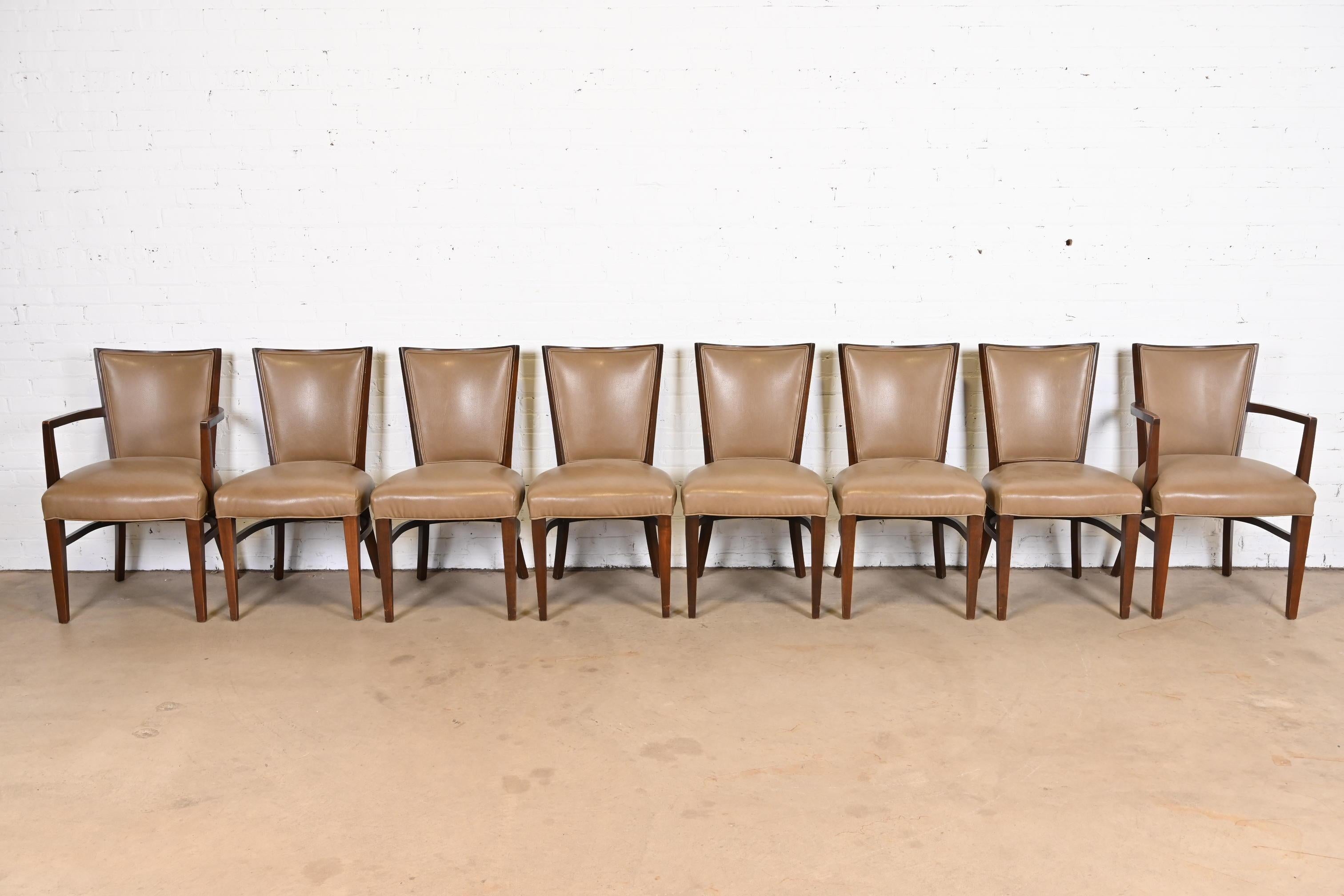 An outstanding set of eight Art Deco or Mid-Century Modern dining chairs

By Thonet

USA, circa 1940s

Solid sculpted walnut frames, with newer tan leather upholstery.

Measures:
Side chairs - 19.75