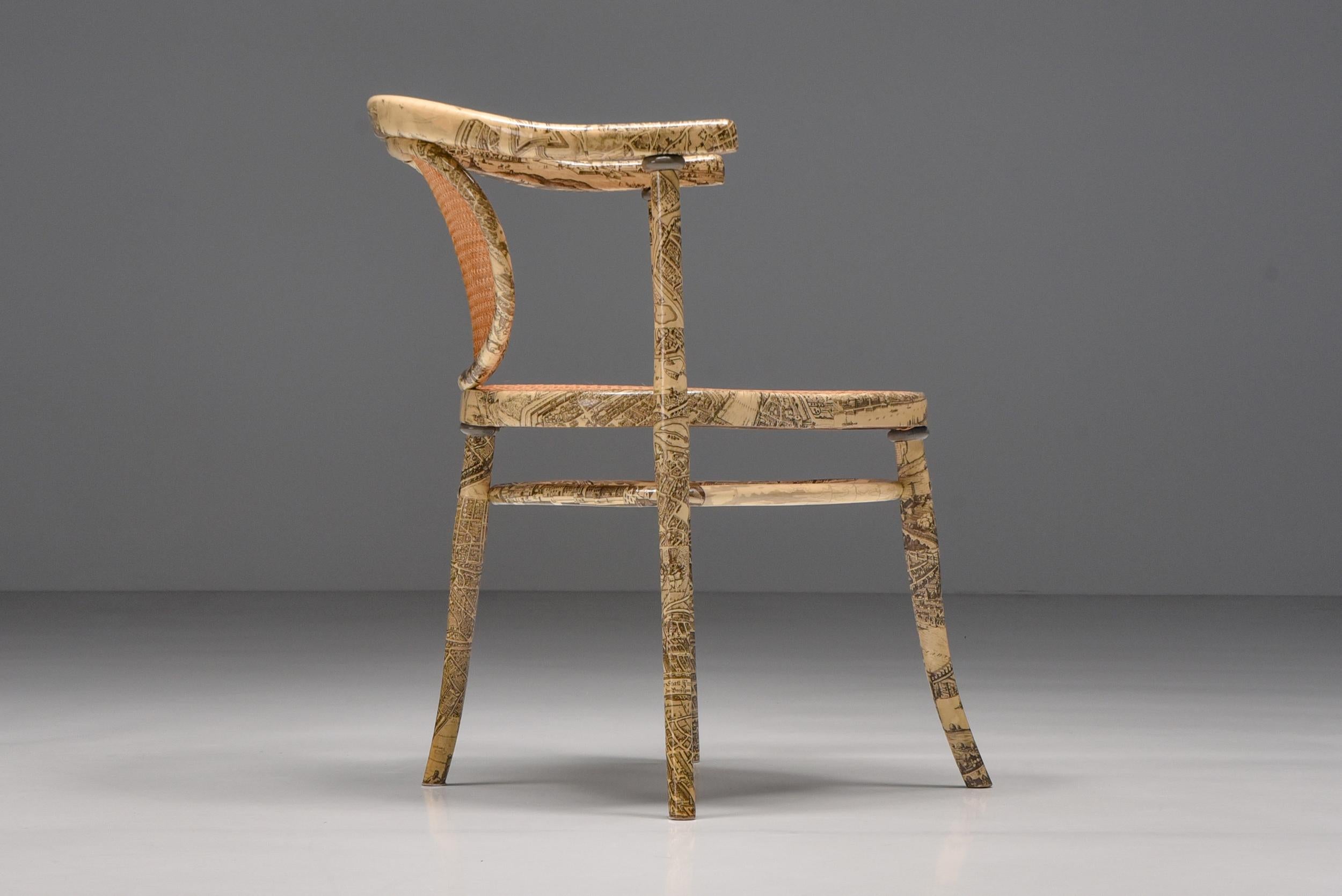Thonet; Fornasetti; Empire; 1905; Germany; Lounge chair; Armchair; Asymmetrical chair; saddle-shaped seat;

This asymmetrical chair from Thonet features a saddle-shaped seat. The seat and backrest are woven in rattan. The frame has later been