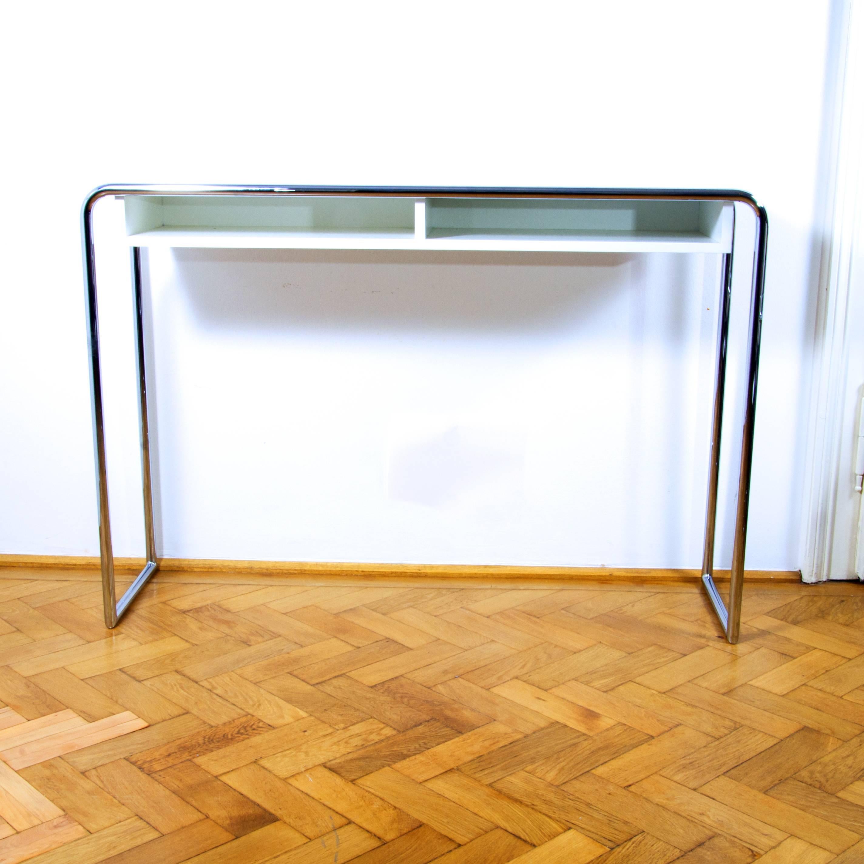 Beautifully designed elegant console table B 108 with compartment by Thonet. The design dates back to the year 1930/31 and was first presented in Thonet’s catalog of that year. 
The invention of tubular steel furniture is very closely connected to