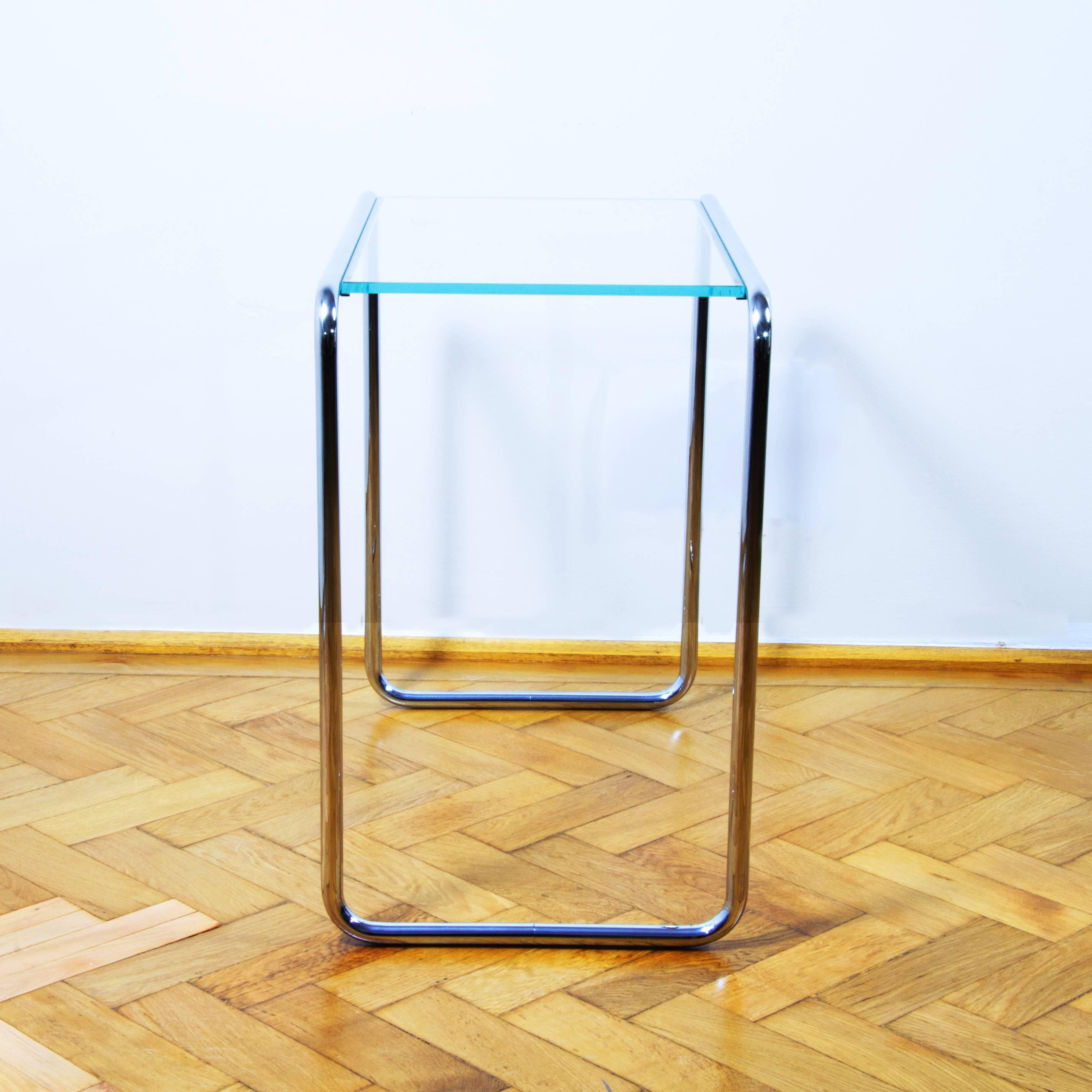 Beautifully designed by Marcel Breuer elegant side table B9 with glass tableplate by Thonet. The design dates back to the year 1932 and was first presented in Thonet’s catalog of that year. 
The invention of tubular steel furniture is very closely