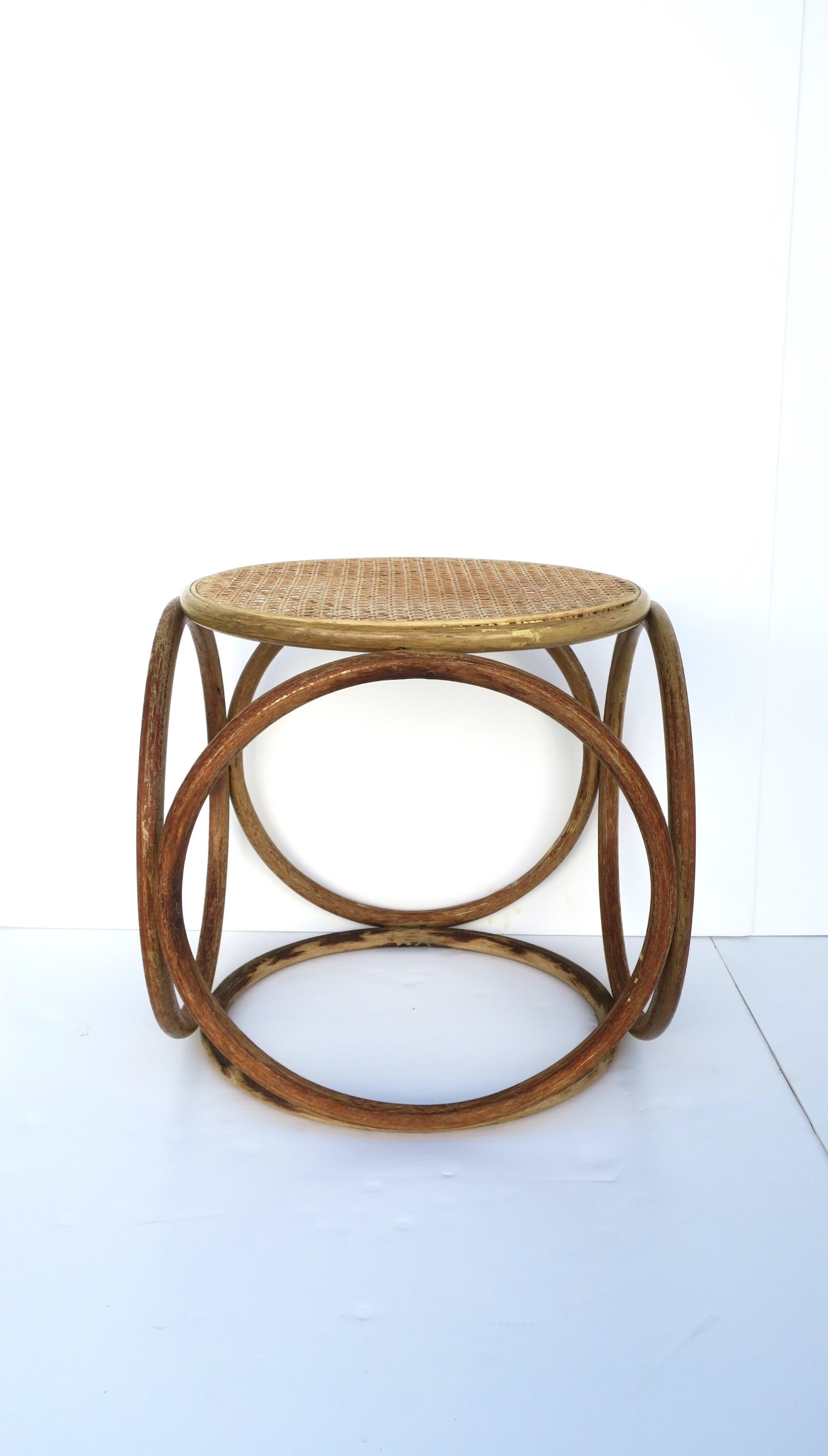 A beautiful modern bentwood and cane top stool or side drinks table, in the style of Thonet, circa early to Mid-20th Century, Europe, possibly Austria. This stool or table has a weather bentwood frame and blonde cane top. Great as a side drinks