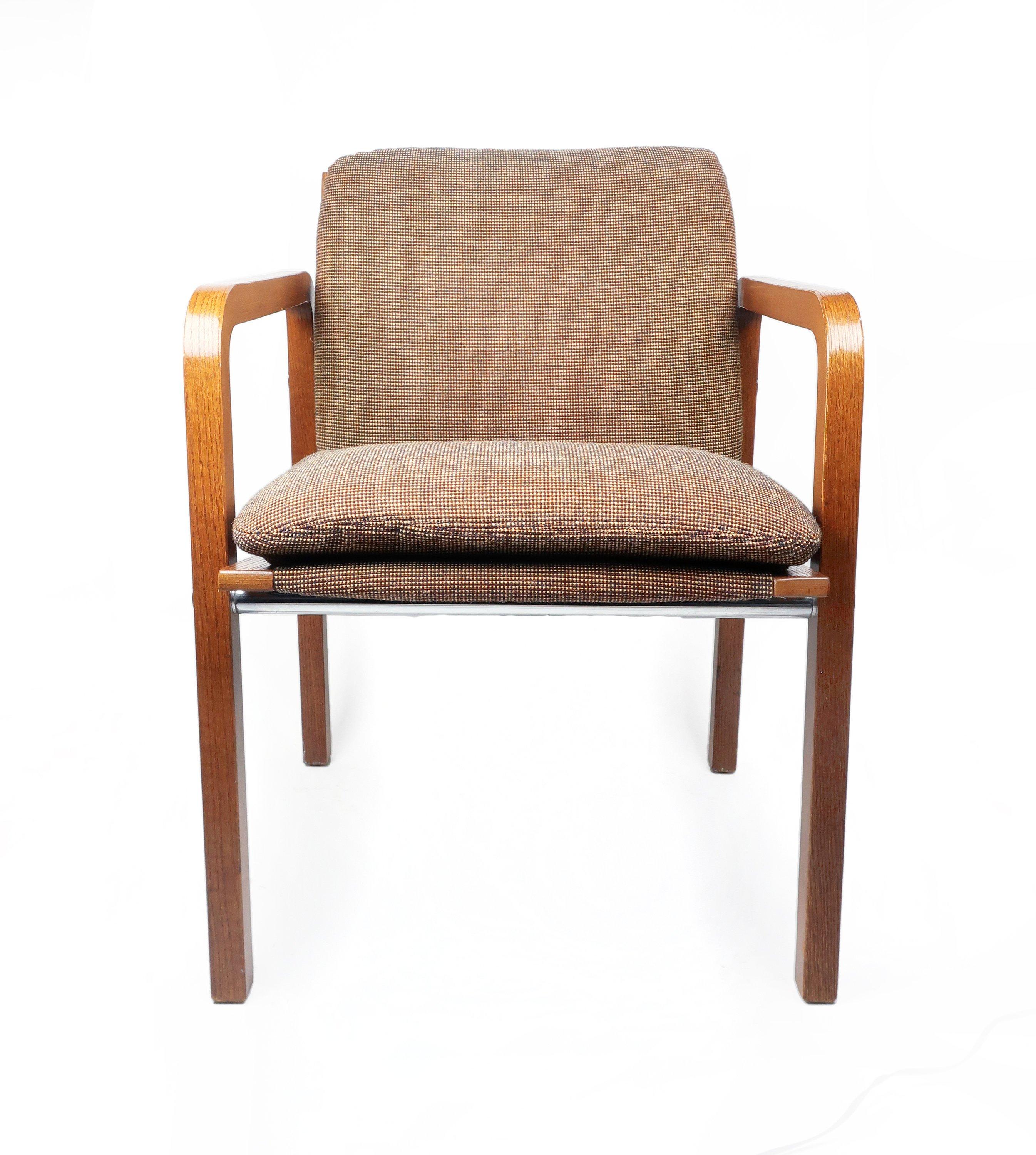 A Mid-Century Modern upholstered bentwood armchair by Thonet. Retains the original light brown wool upholstery on a beautiful oak frame with chrome accents.
 
 Seat cushion was recently reinforced to ensure many more years of comfortable sitting!