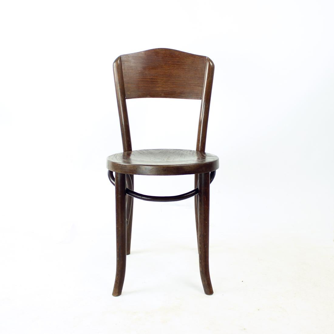 Beautiful vintage chair designed by Thonet. Bentwood details and construction makes this piece a timeless item. Plywood seat and backrest. Strong oak wood. The chair was partially restored to make sure the construction is strong and put together.