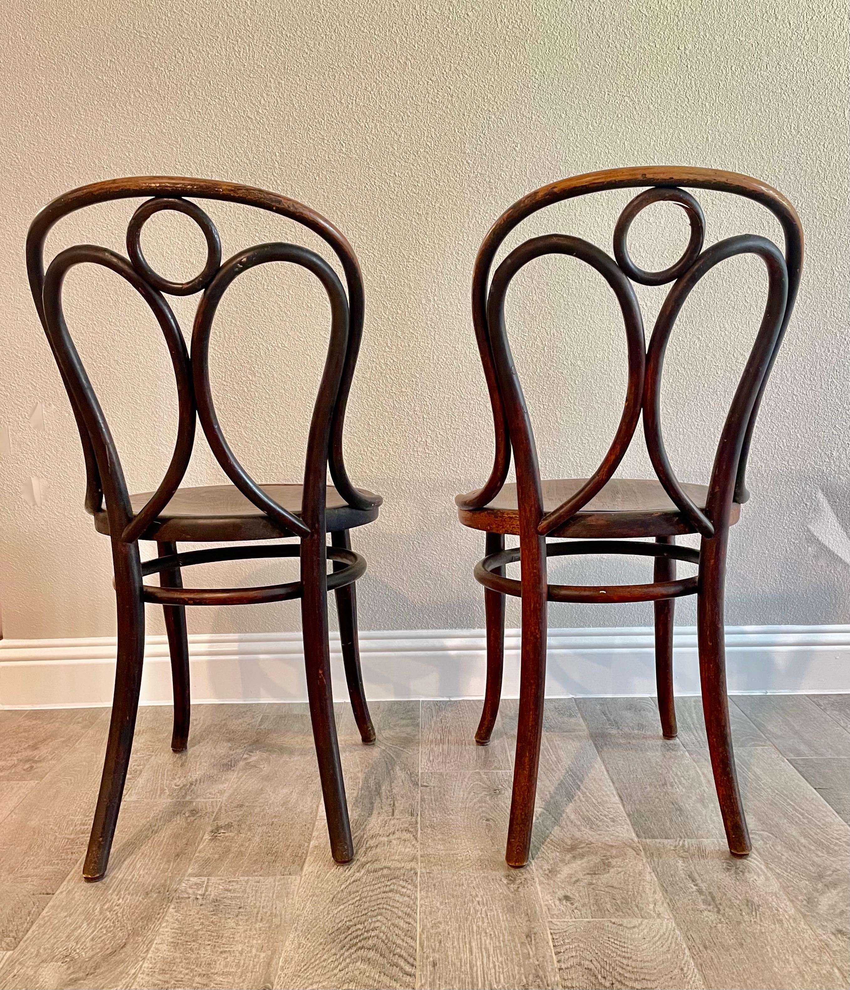 A pair of Thonet Bentwood chairs side chairs/ Bistro chairs. These are very fragile but would look great in an entry way or reading corner. Original label still attached.