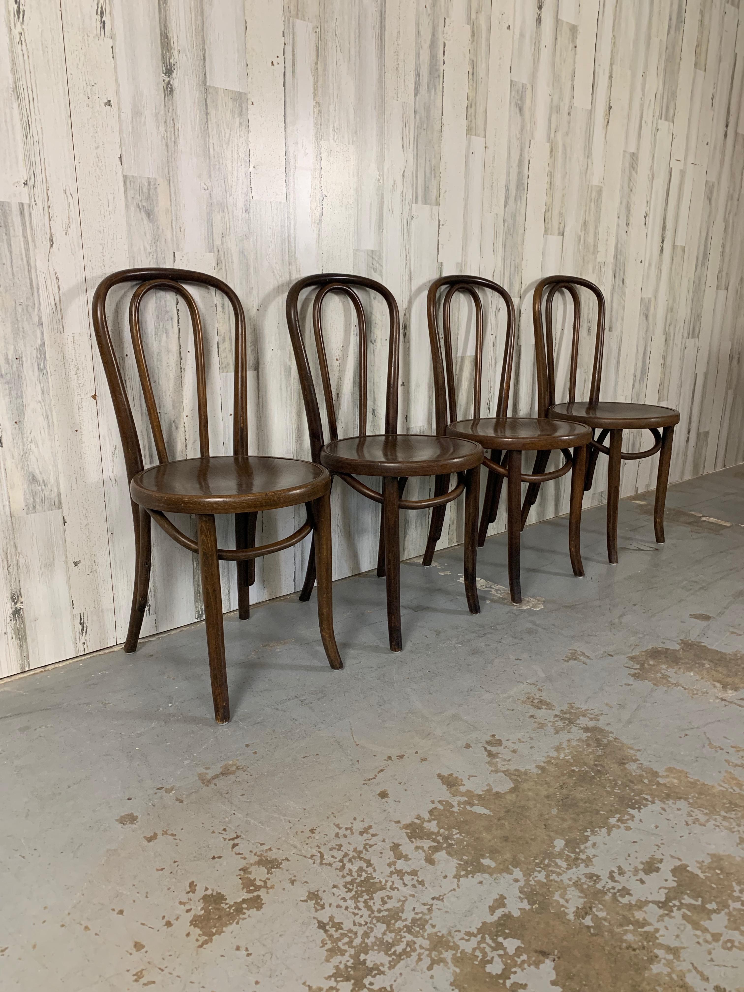 Made in Czechoslovakia in the 1920's at the height of Thonets bentwood production. This set of four is hard to come by in nice condition. 