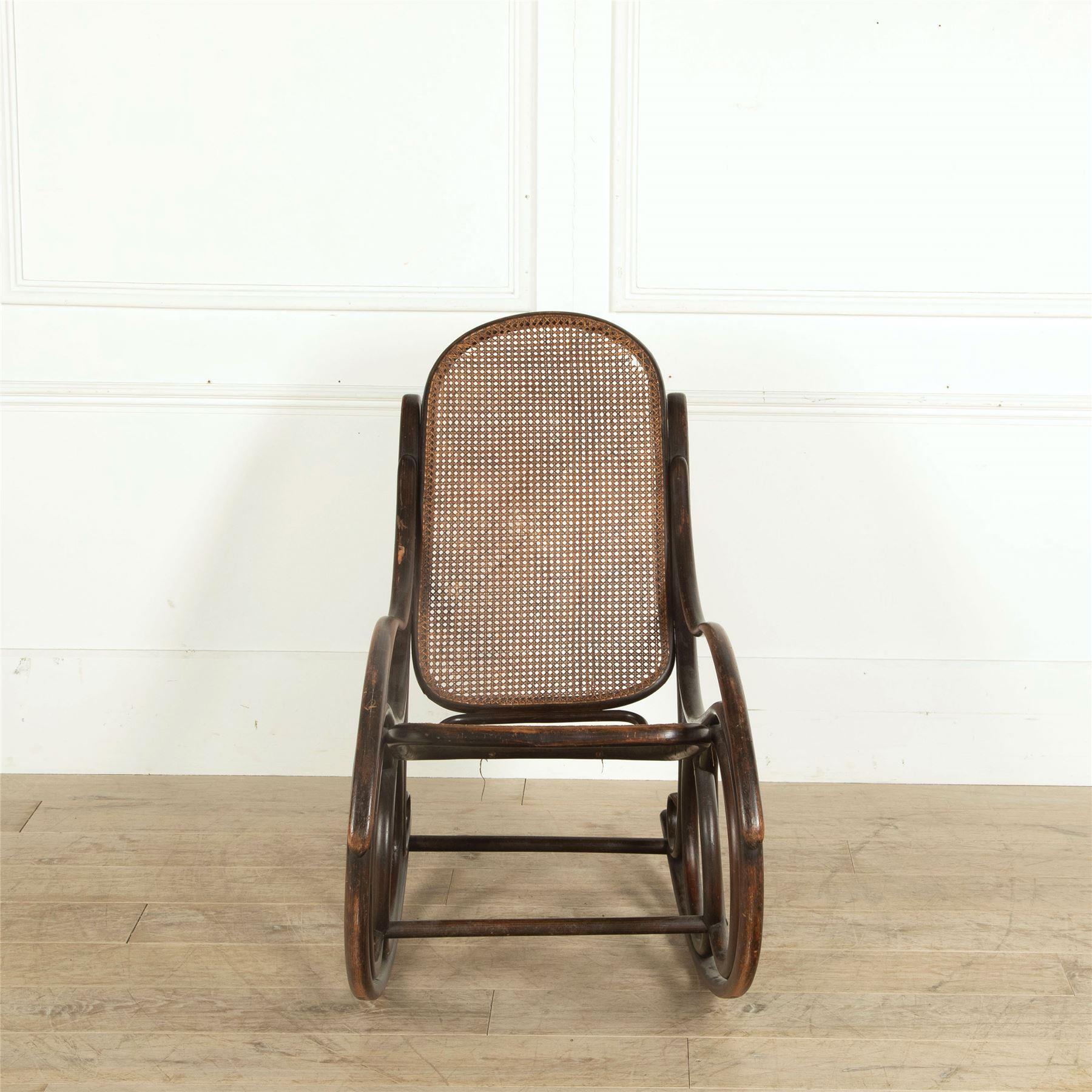 A late 19th century Thonet bentwood and cane rocking chair.