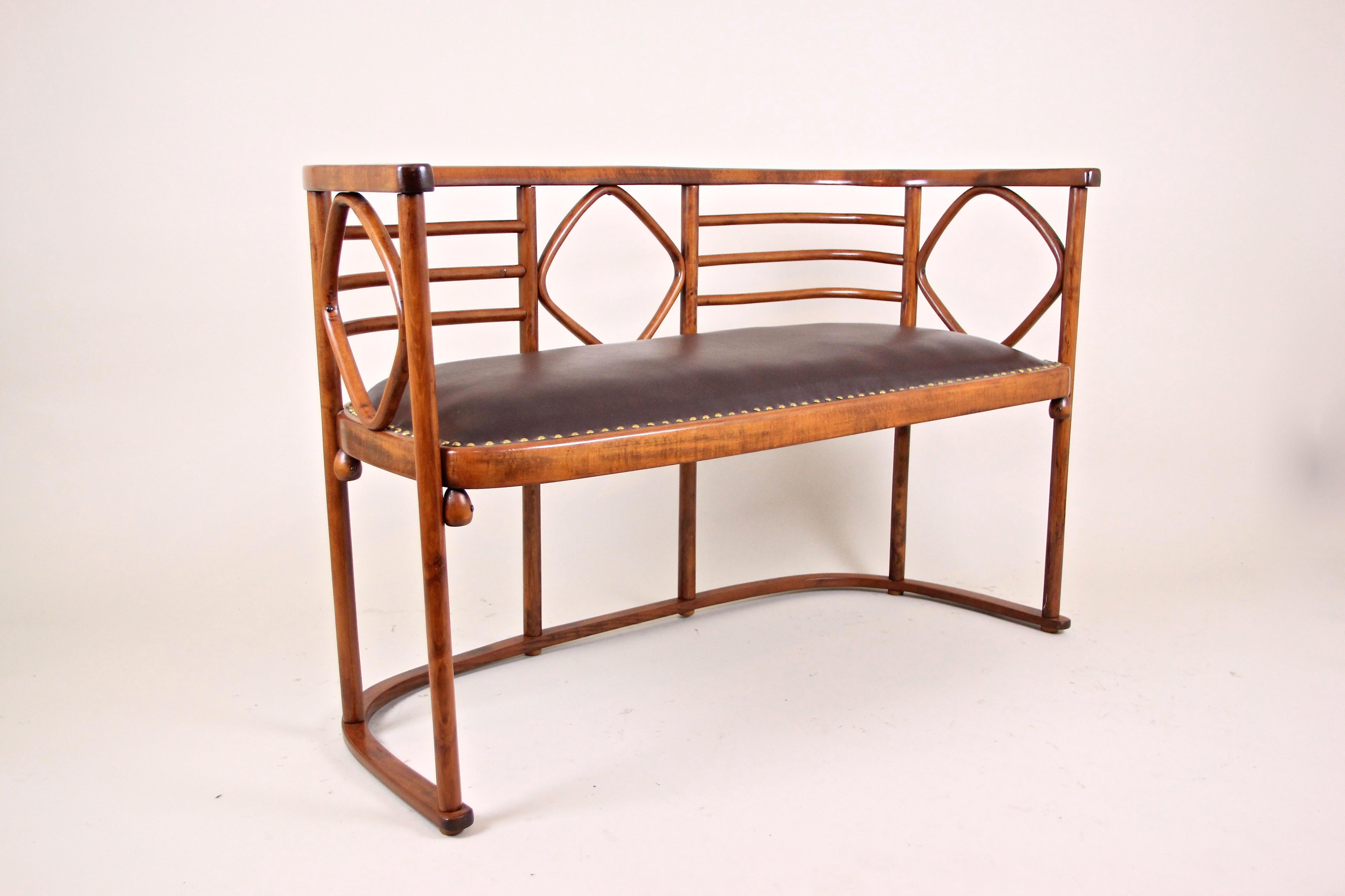 Beautiful bentwood seating set attributed to Thonet, designed by the famous Austrian architect Josef Hoffmann, around 1910. Extraordinary shaped of fine bentwood (=beech was bent under steam and high pressure), the bench and the two armchairs carry