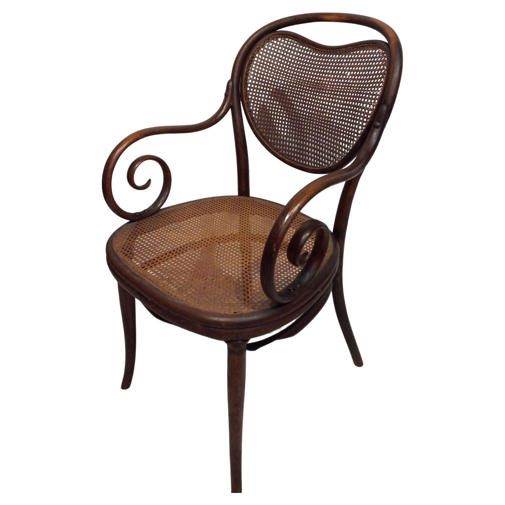 Rattan Thonet chair from the 1870s with curved armrests For Sale
