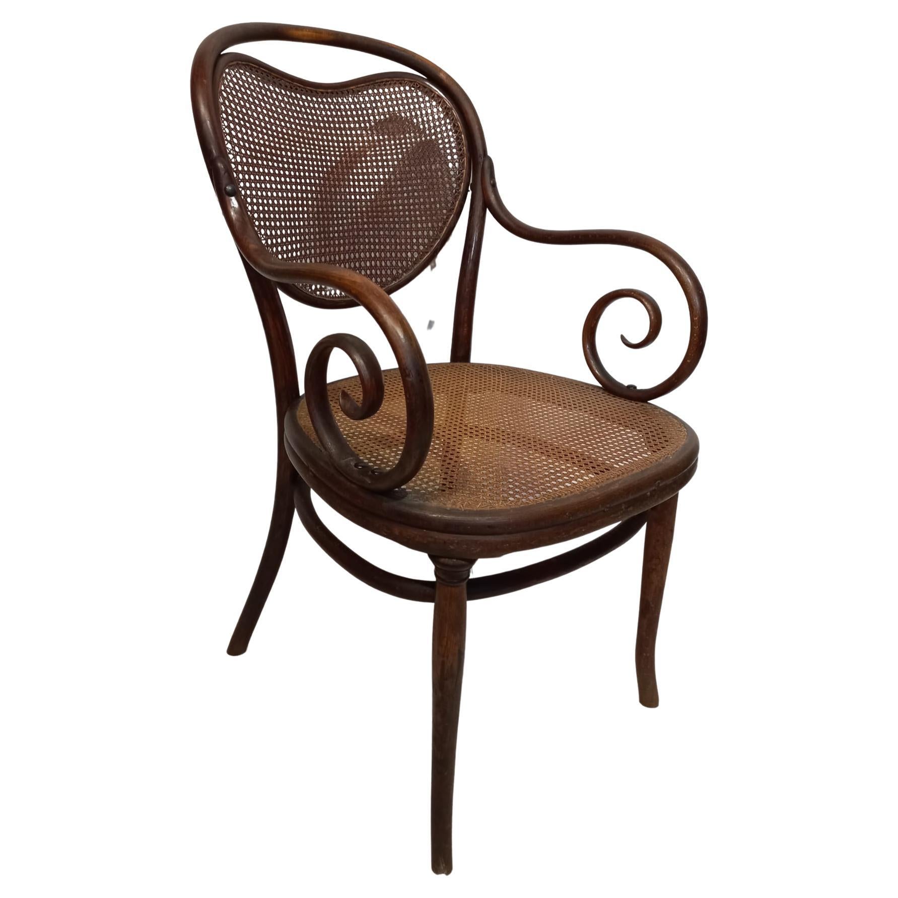 Thonet chair from the 1870s with curved armrests For Sale