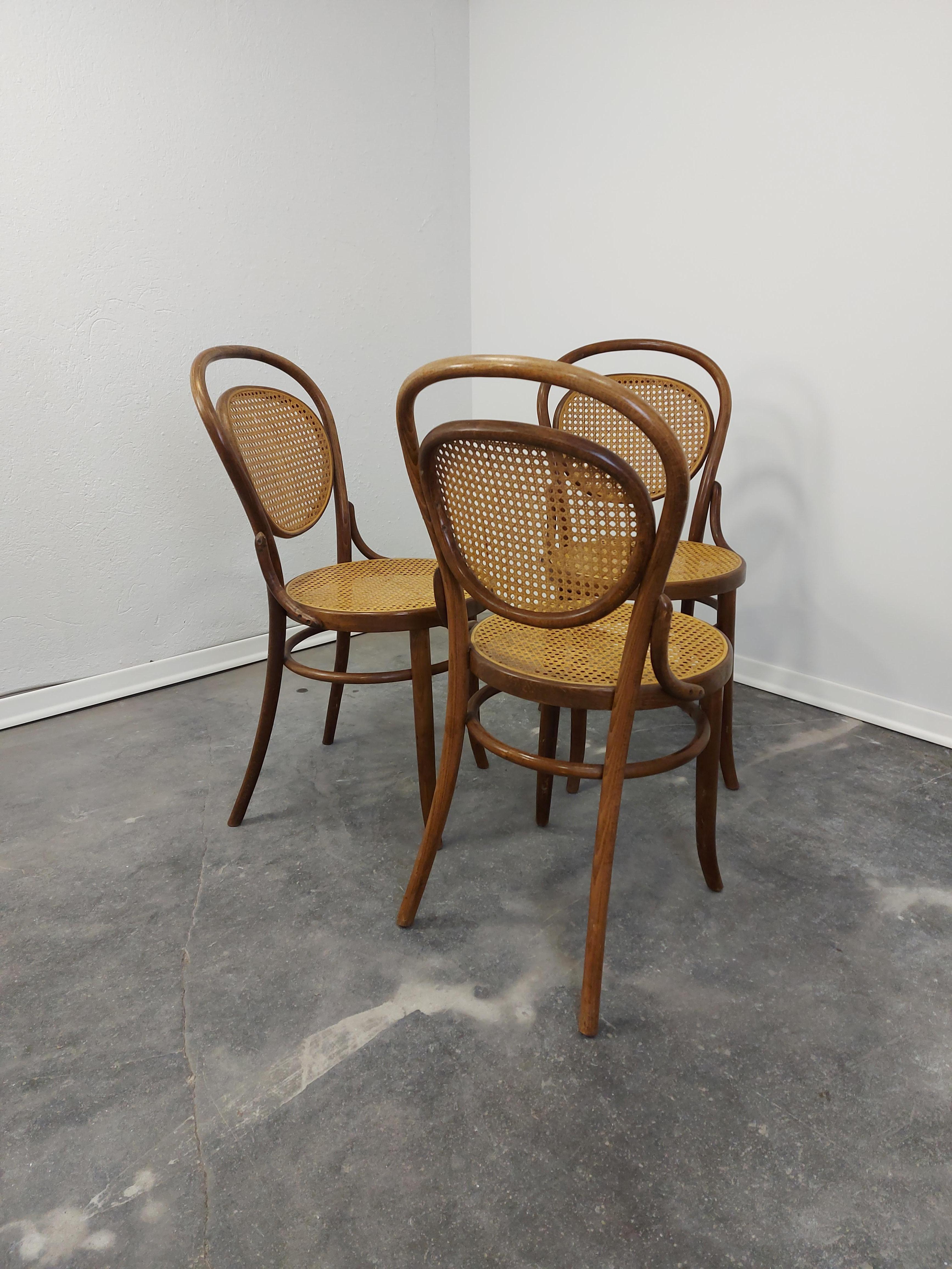1 of 3 Thonet No. 215 chairs was manufactured 1960.
The chair was designed by Michael Thonet in 1859. 
It features a beech bentwood frame with cane. 
Clear wood finish. Wood and cane are in good condition. 
Price is for one chair.