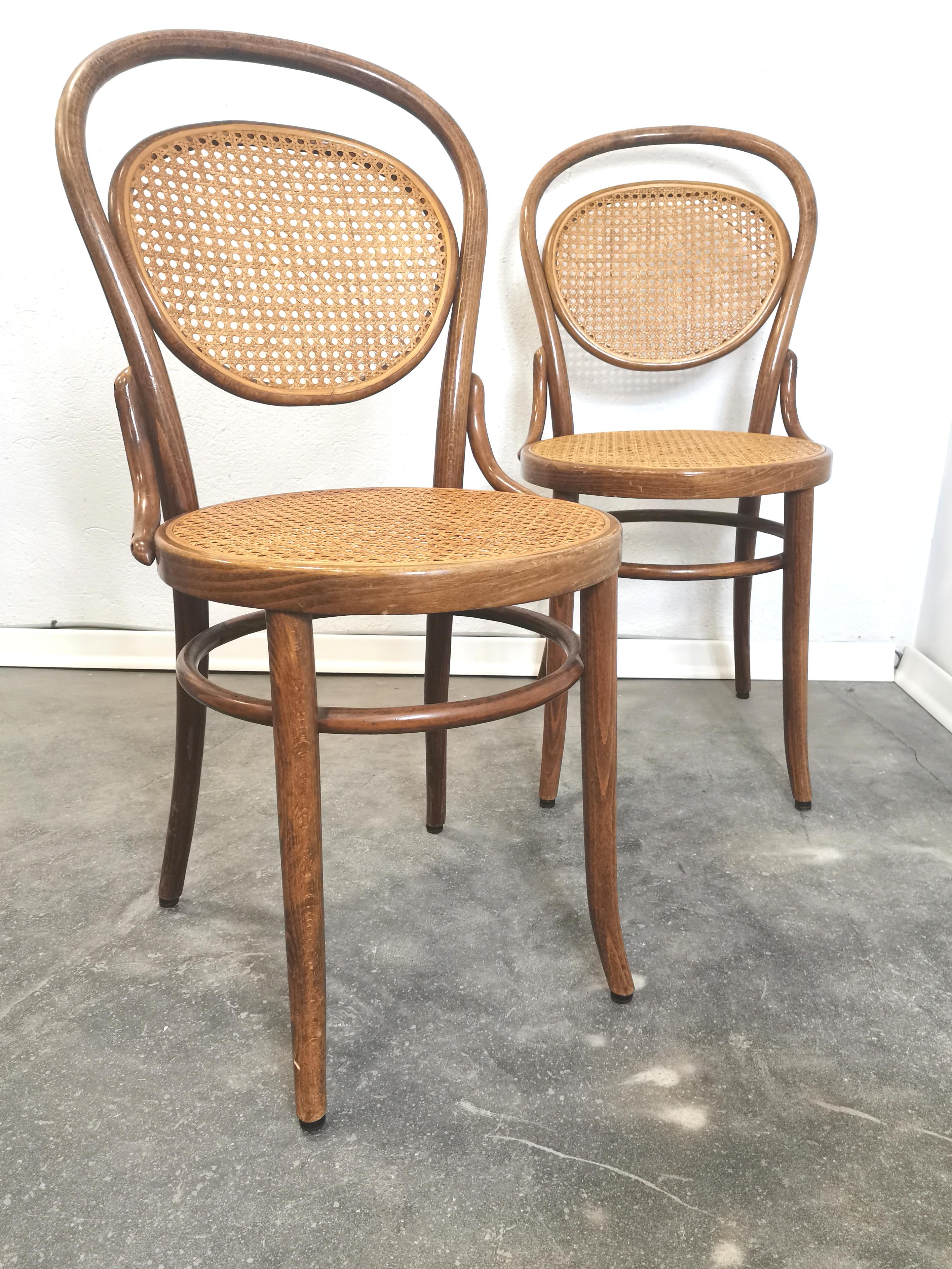 1 of 4 Thonet No. 215 chairs was manufactured 1960.
The chair was designed by Michael Thonet in 1859. 
It features a beech bentwood frame with cane. 
Clear wood finish. Wood and cane are in good condition. 

Price is for one chair.

Cane seat on two