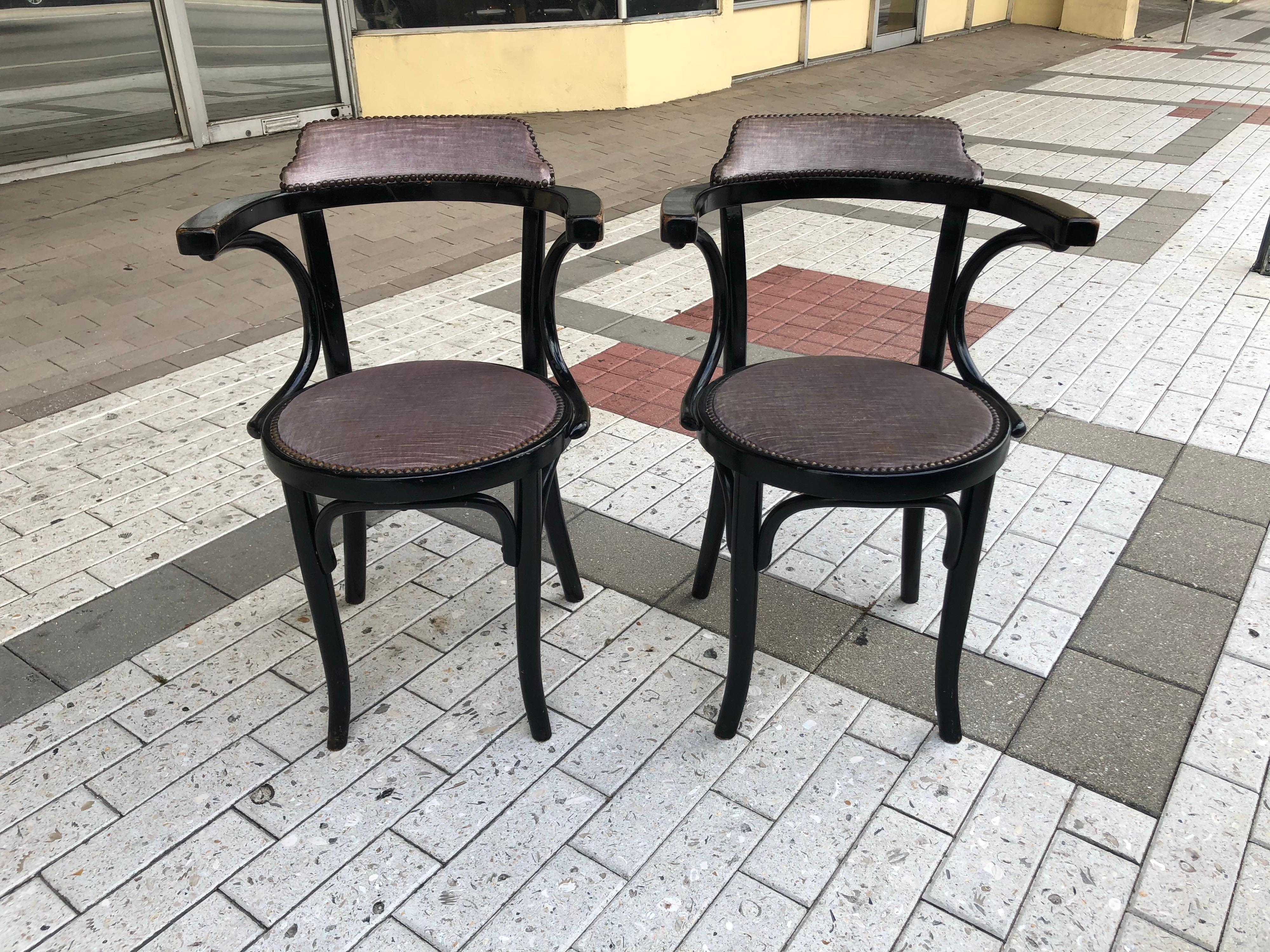 These four black ebonized Thonet chairs from Art Nouveau period are all original and distressed beautifully and appropriately for their age, circa 1920s. They are upholstered in 