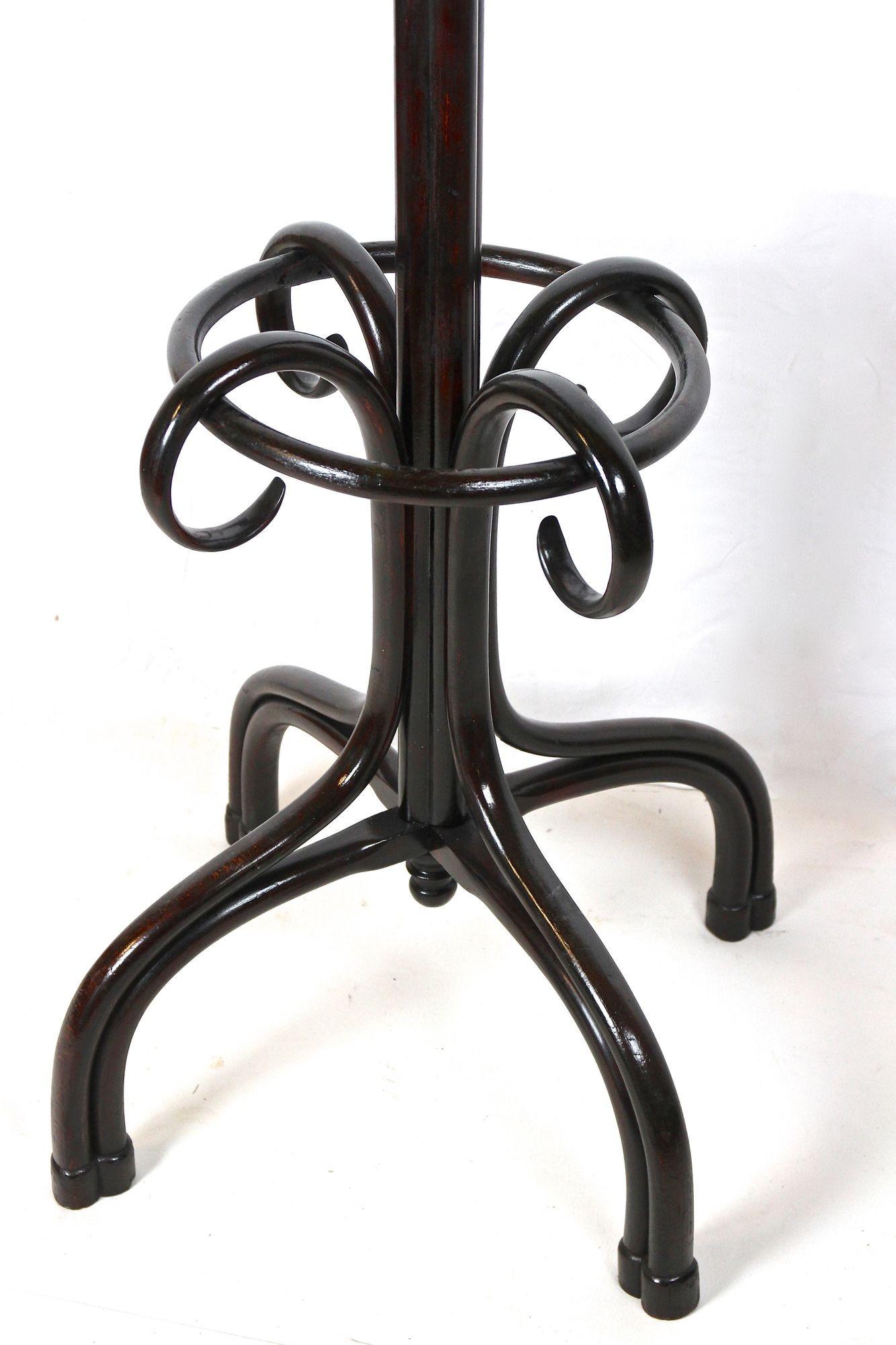 Beautiful, large bentwood coat rack or wardrobe stand from the world renowed company of Thonet. Elaborately made in the early 20th century around 1905 it shows a spectacular design. Coming in perfect restored original condition, this freestanding