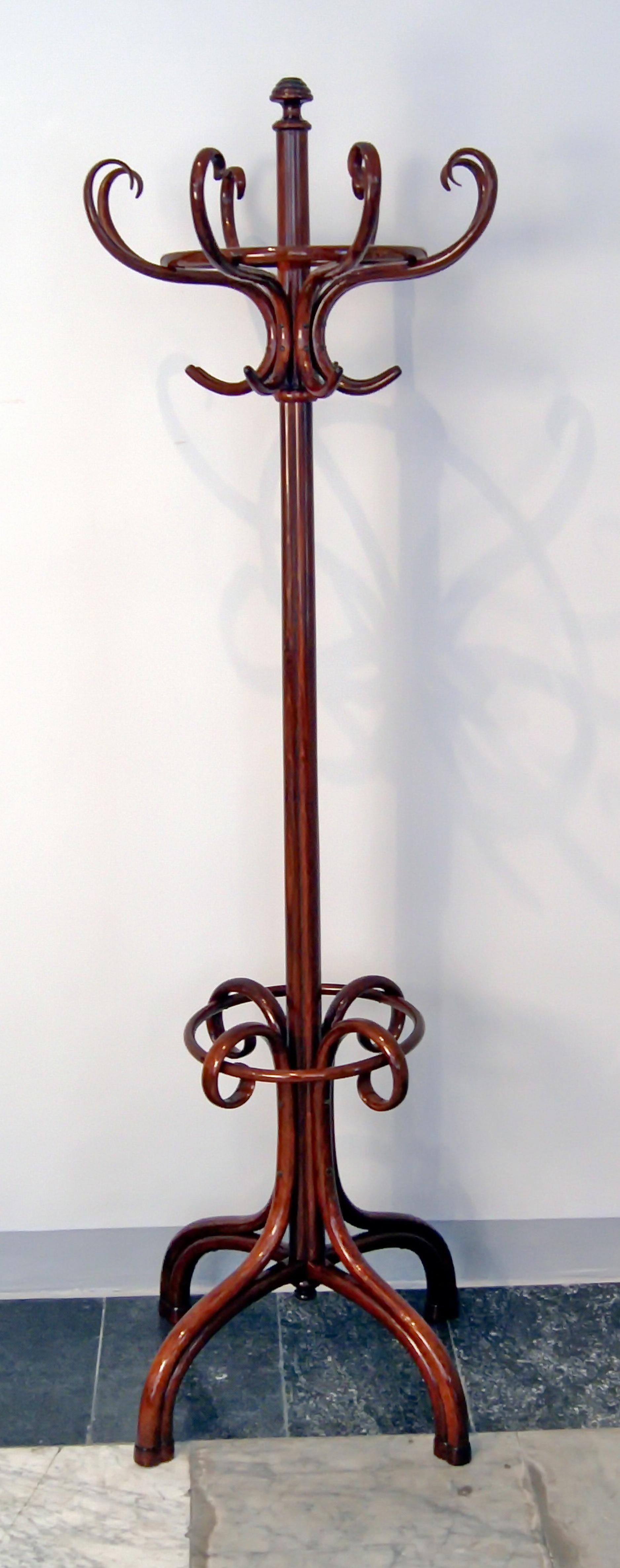 Thonet coat-tree / coat rack, model number 1 (authenticity guaranteed !)

beech wood, mahogany stained / high quality handwork / refurbished by hand
This Thonet coat-tree / coat rack is of finest form type: It is accentuated by various circular