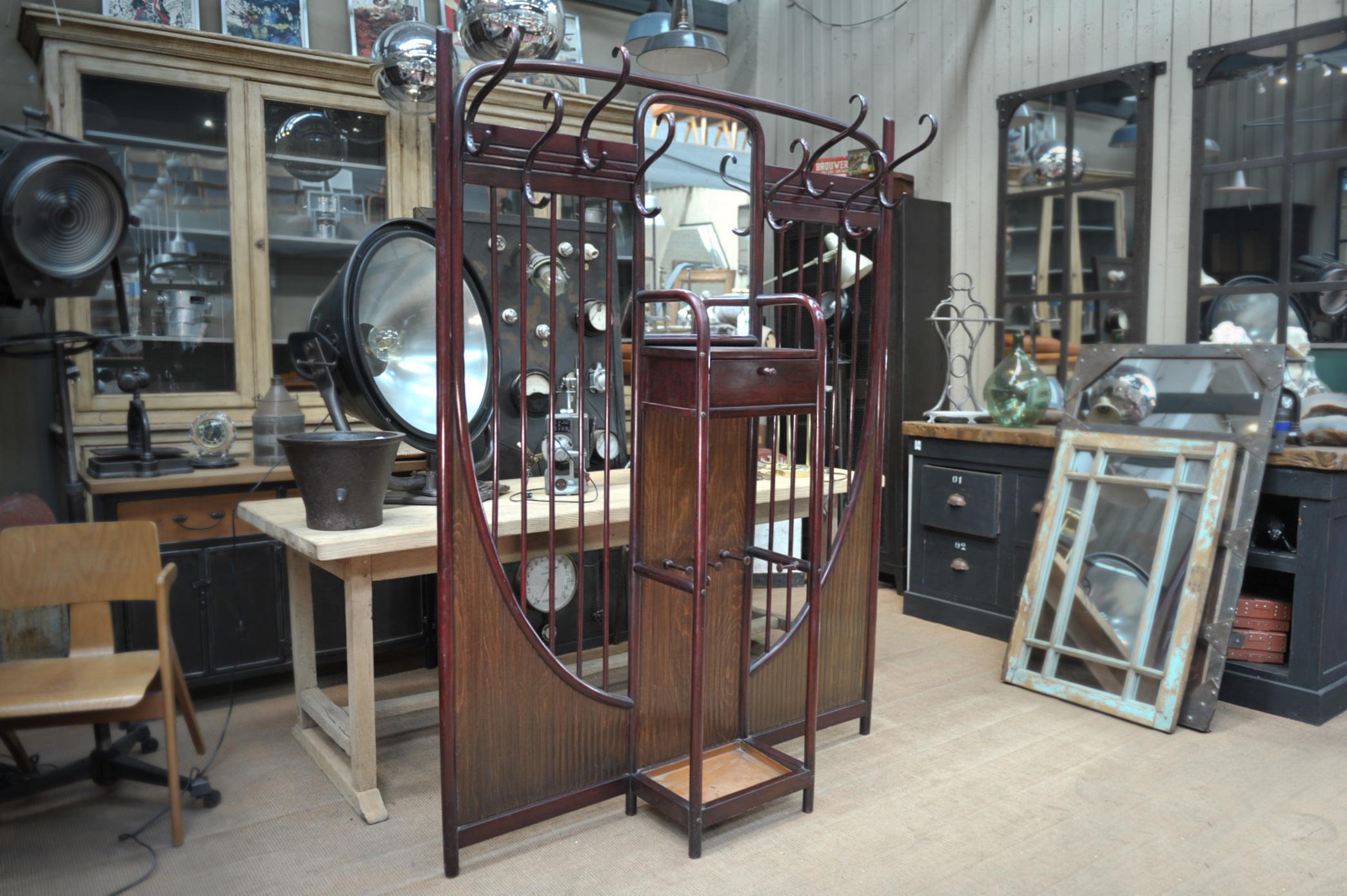 Curved beechwood Thonet coat rack and umbrella stand with original mirror circa 1900 by and signed Thonet.