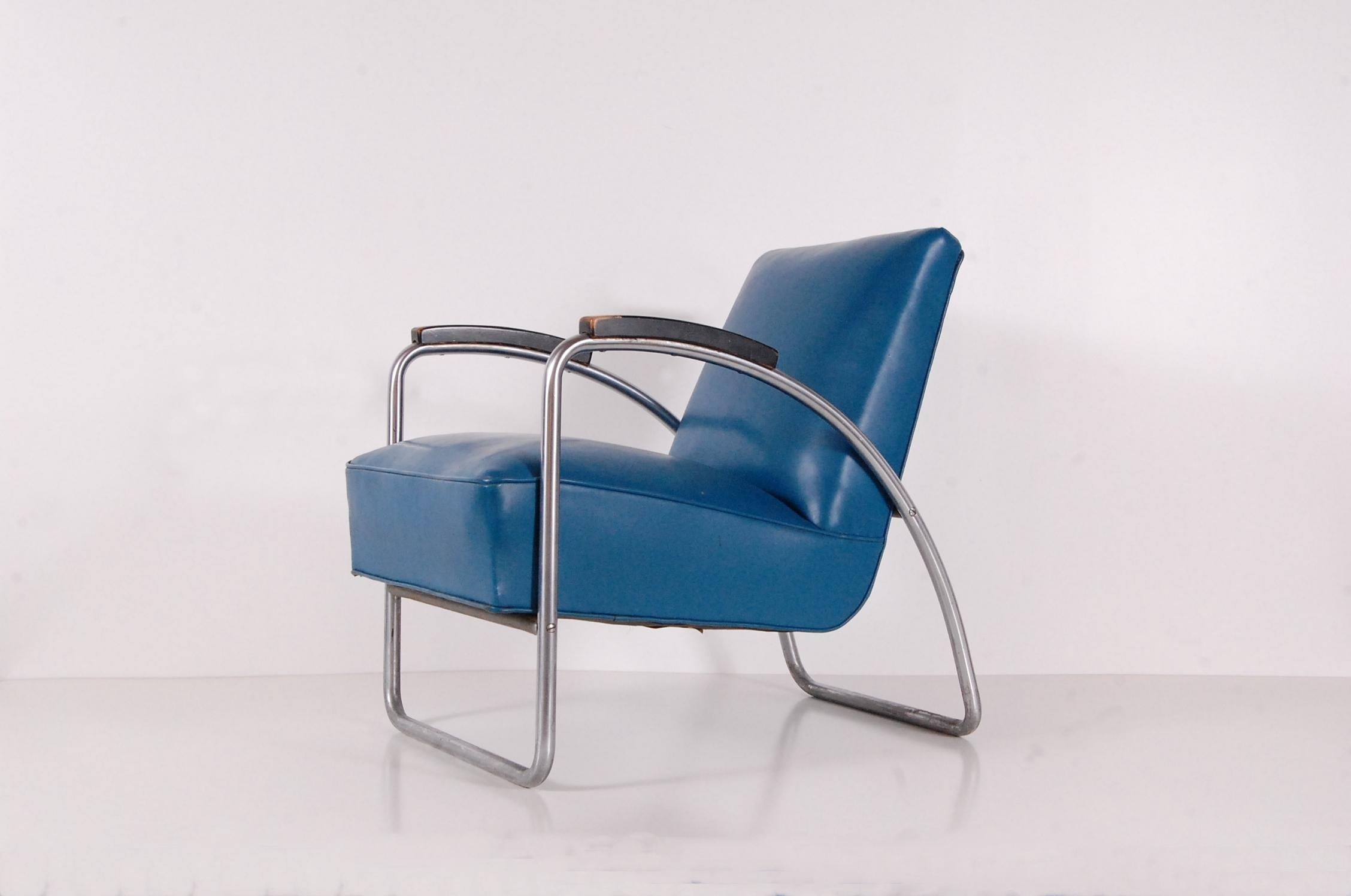 Thonet lounge chair in nickel-plated tubular steel with black lacquered wood arms, circa 1932-1938. Chair was removed from the famous Philadelphia Savings Fund Society building in Philadelphia, designed by William Lescaze and George Howe in 1932.