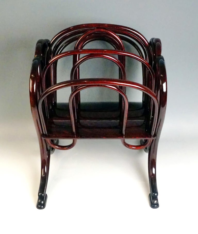Thonet Vienna most elegant music, newspaper and magazine rack

High quality handwork, stunningly shaped bentwood, superb appearance
Beech wood, dark mahogany stained, shellac hand polished

Manufactured by Thonet Brothers, Vienna, circa
