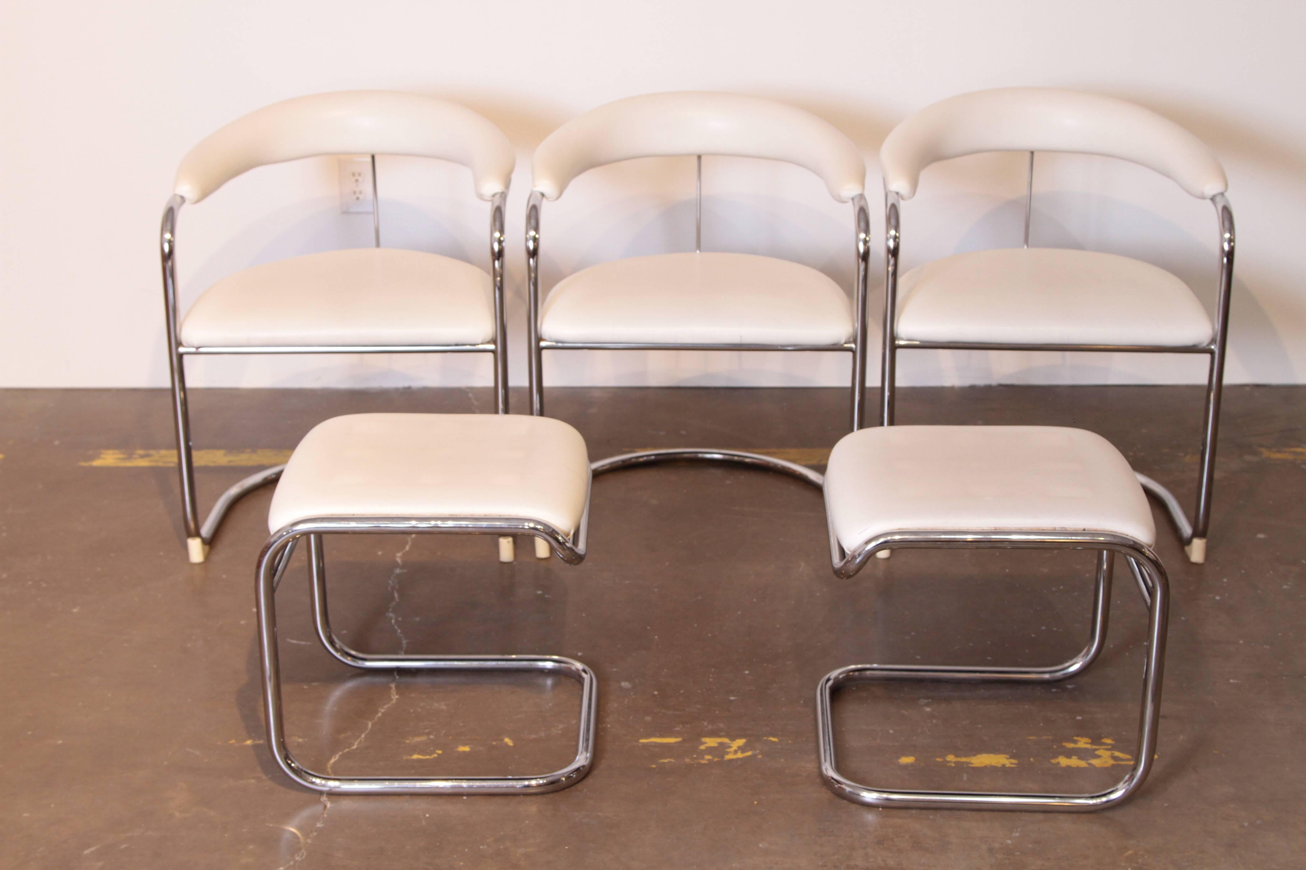 Thonet Mid Century Modern Side Chairs / Ottomans, Five piece set, Leather and Tubular Chrome.  Mid-Century.  

Iconic chair design originally by Anton Lorenz  SS33 for Thonet, likely later US production with plastic front glides.  With matching pair