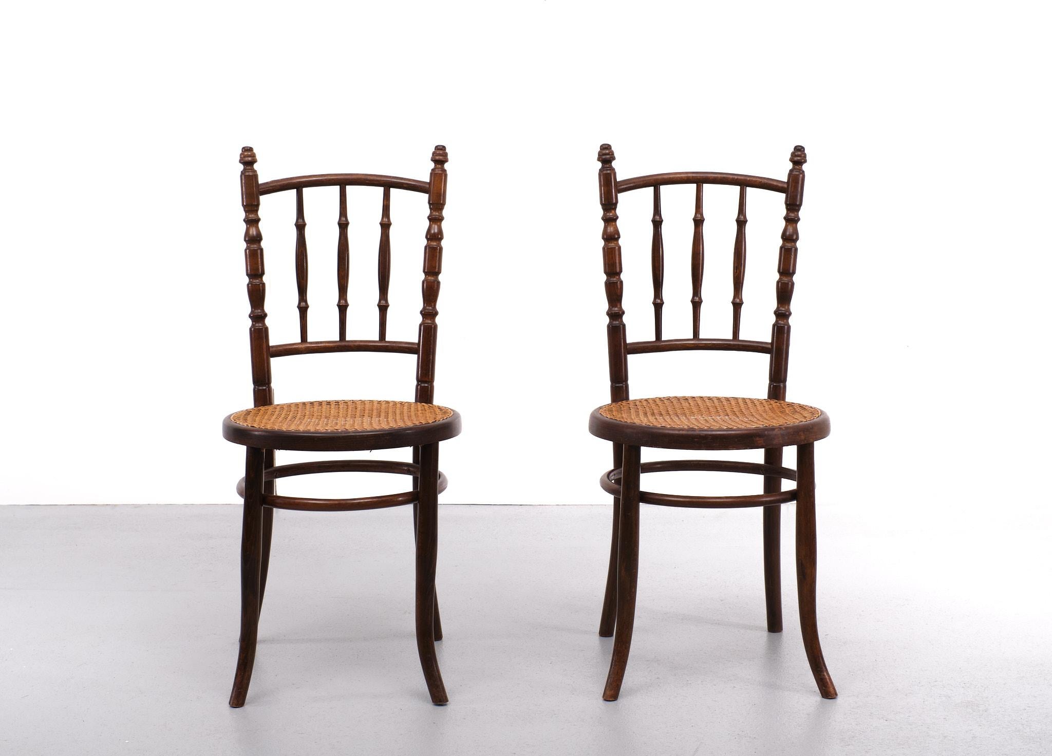 Thonet Mundes dining chairs Beech wood. Wicker seat. Design David Fischer 
for the Gebr Thonet Vienna Austria 1880.
