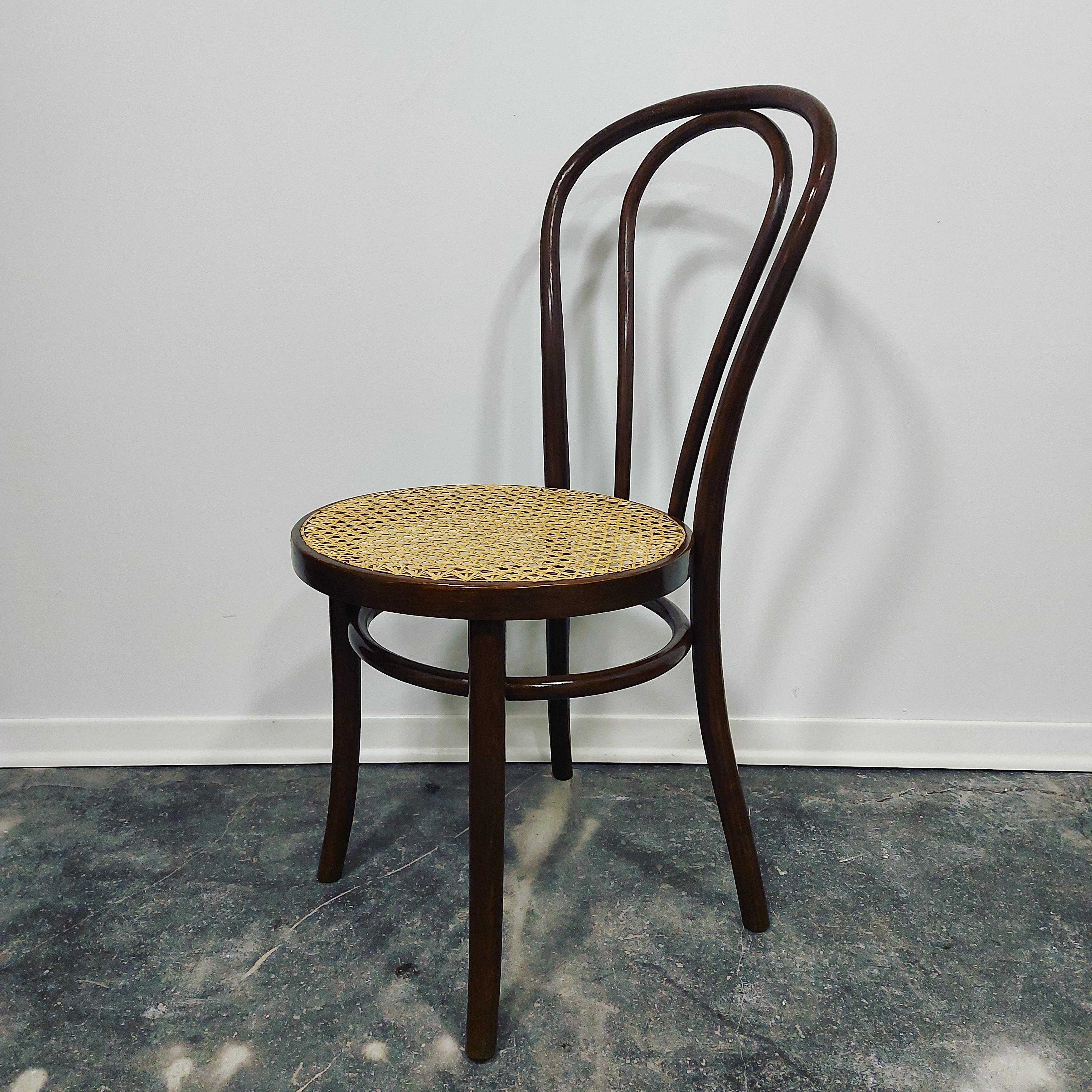 Chair known as model No. 18, with curved beech frame with blachandmade Vienna straw intact. Designed by Michael Thonet in 1876.