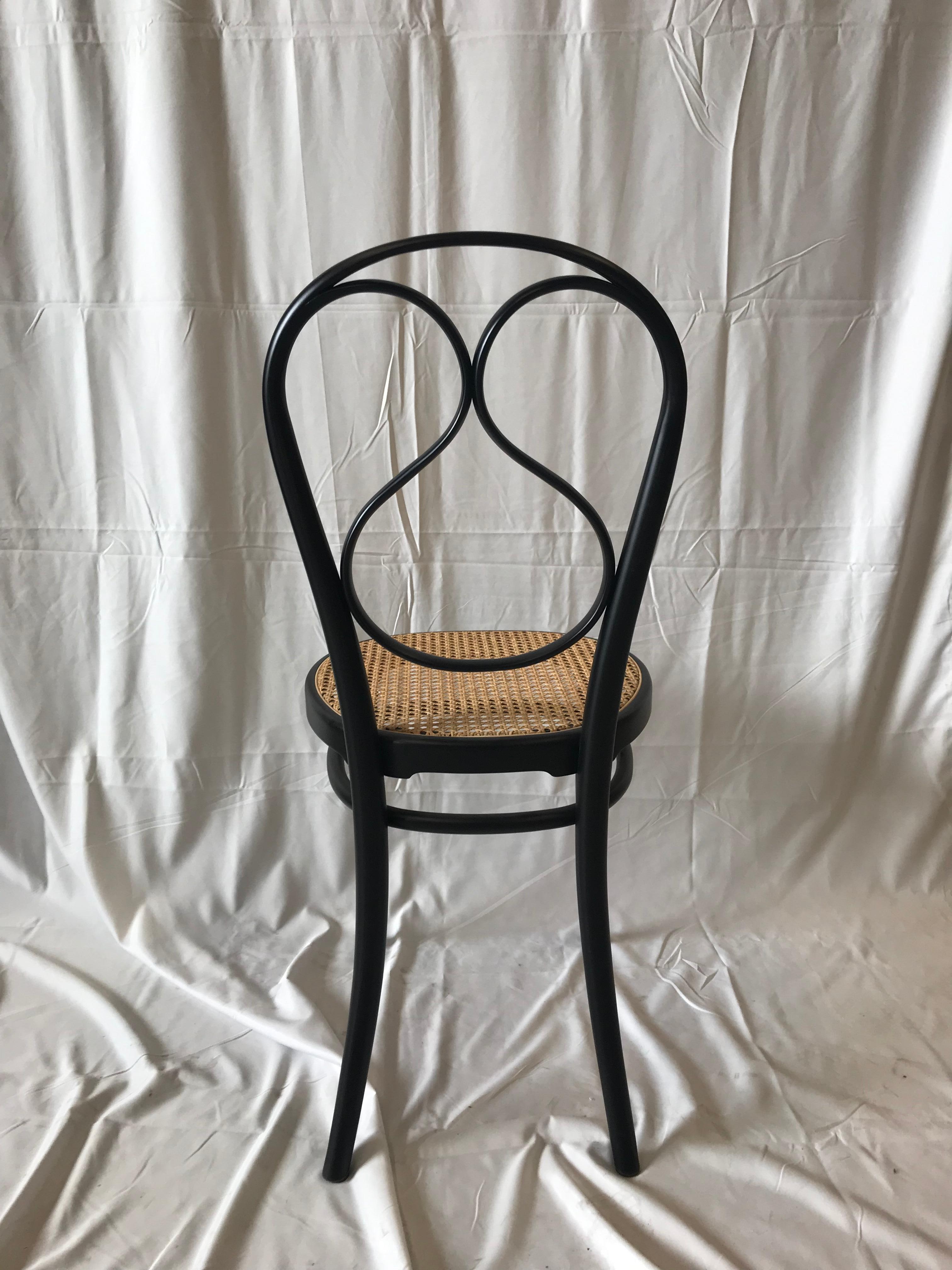 Supple, light, and elegant. This chair, designed in 1849, uses the new technique of steam bent beech wood, and clearly shows the philosophy aimed at simplifying the components to enable mass production. The seat is made from cane.


