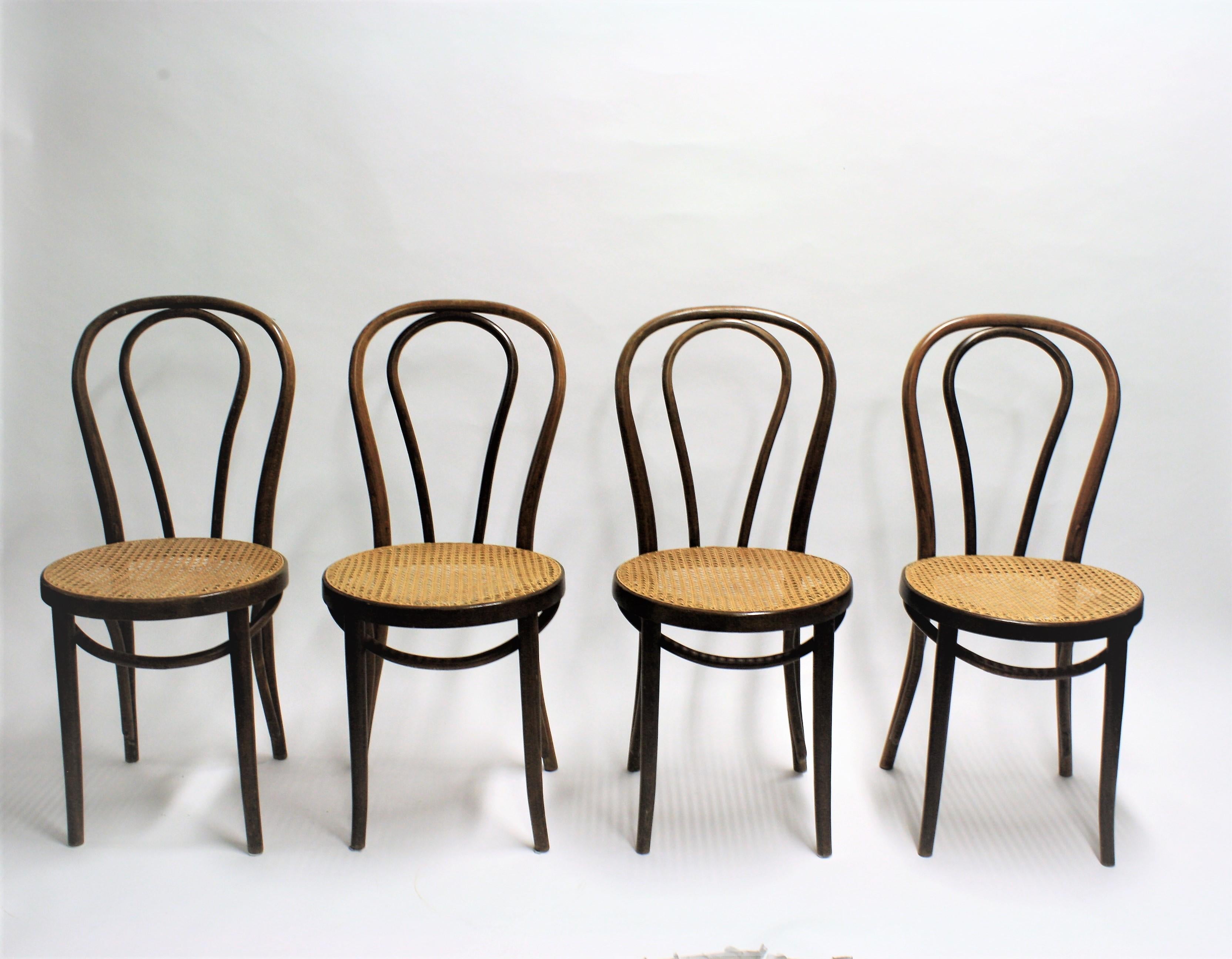 Set of 4 dark brown Thonet no. 18 dining chairs.

The cane seats are in good condition.

1950s - Romania

Dimensions:
Height 90cm/35
