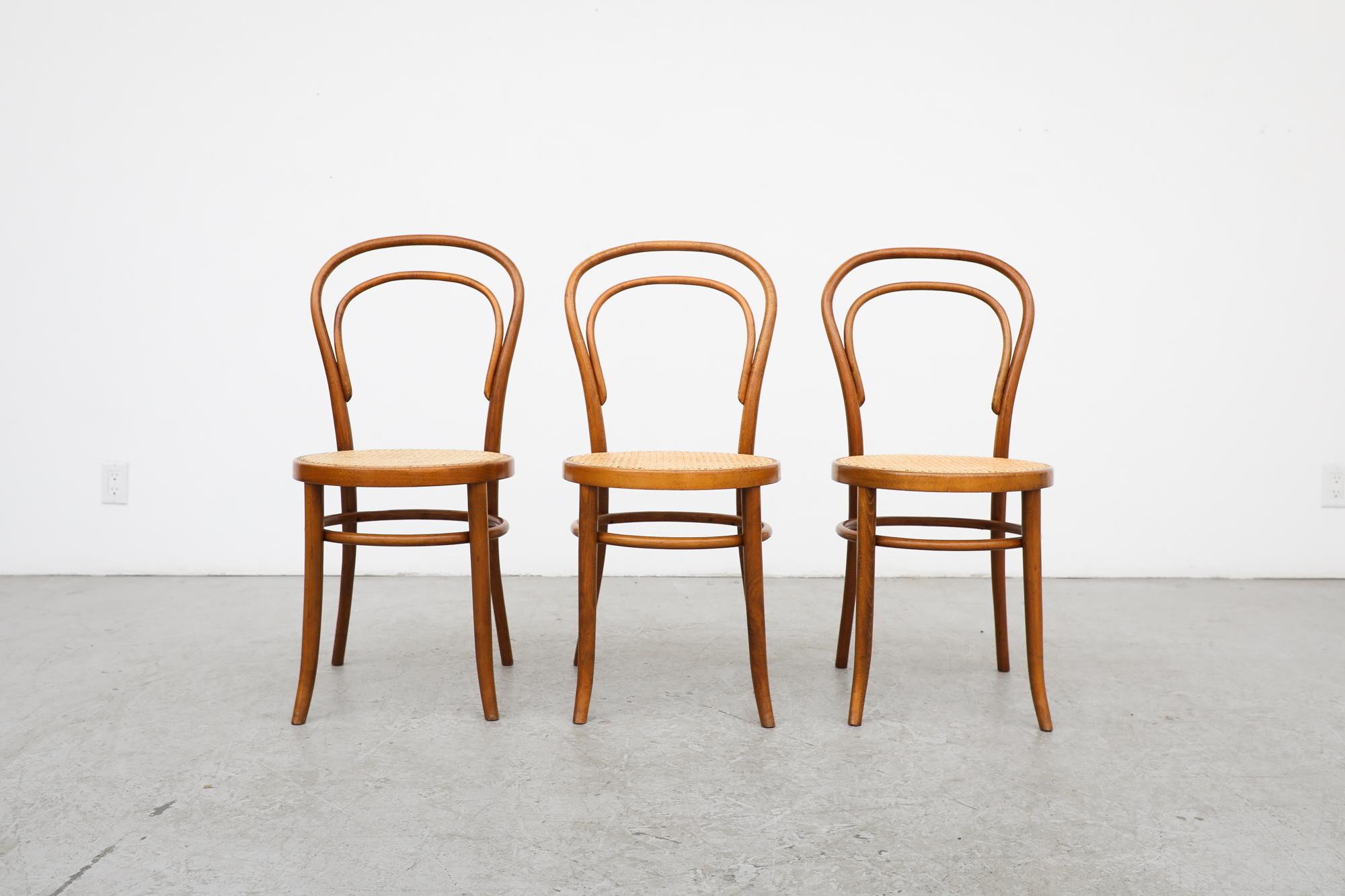 Thonet No. 14 bentwood and cane cafe chairs. In original condition with visible wear consistent with its age and use. Sold individually $550 each.