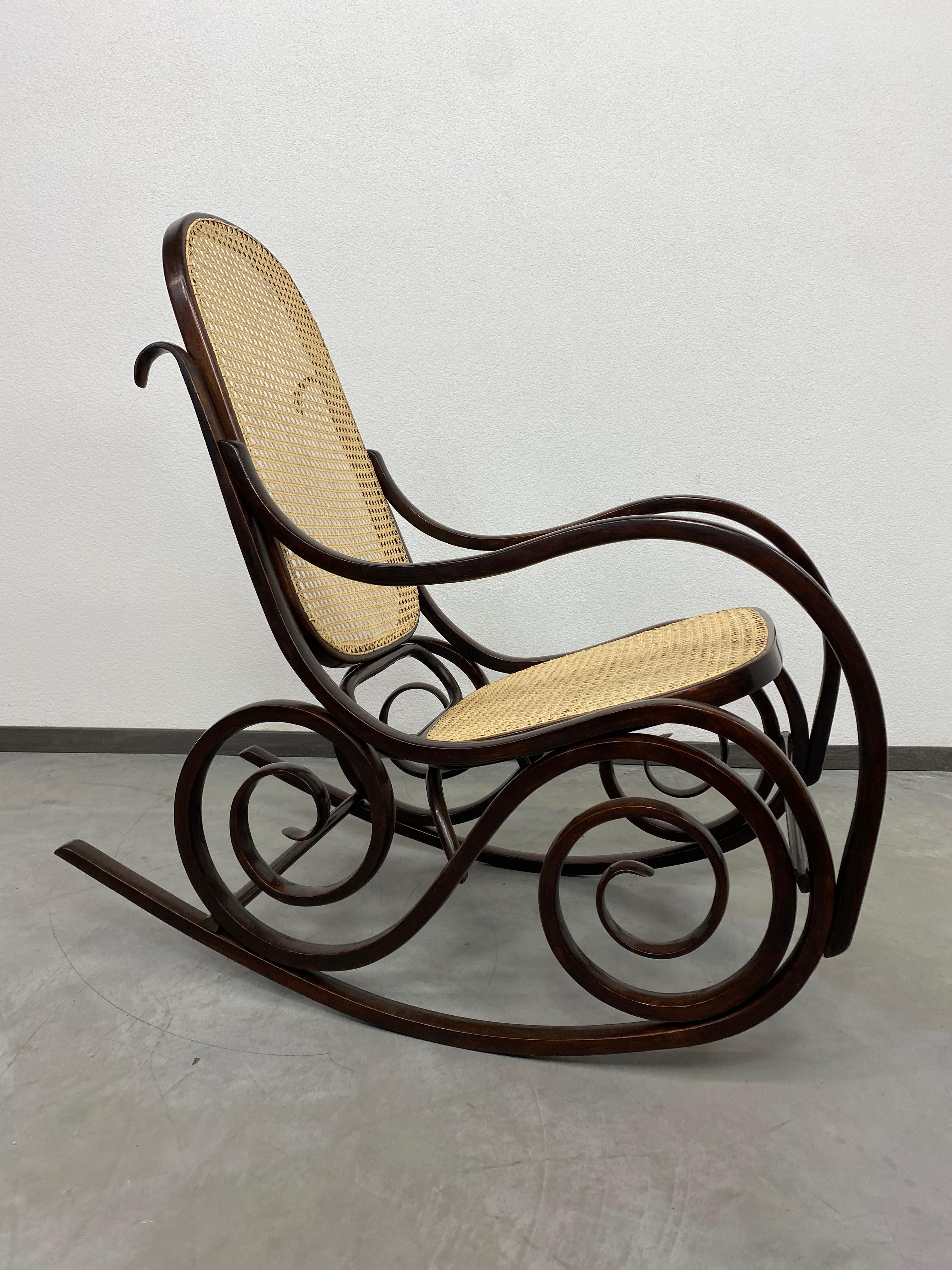 Thonet rocking chair after professional renovation with new handmade rattan seat and backrest