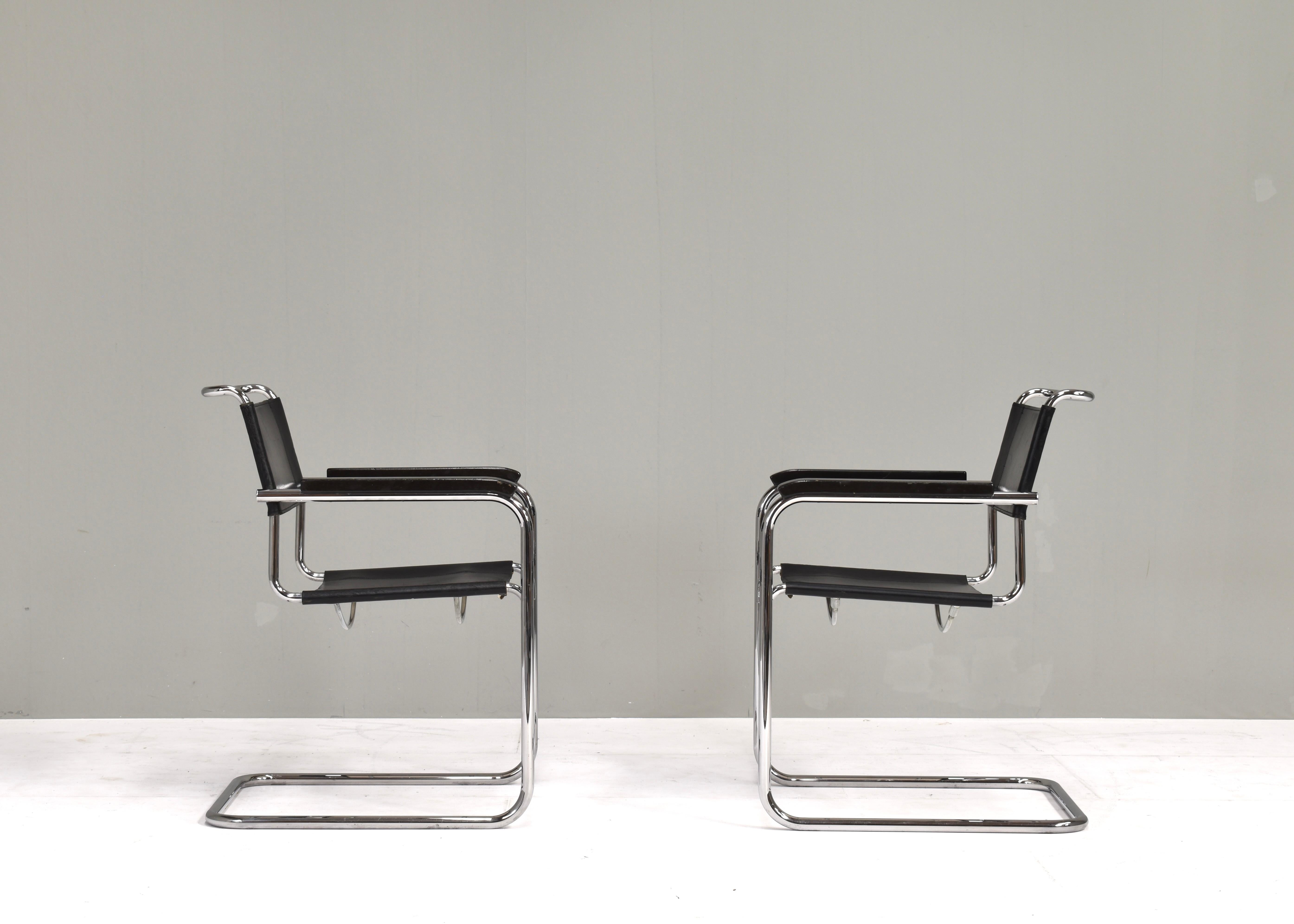 Designer: Mart Stam
Manufacturer: Thonet (stamped in leather underneath seat)
Country: Germany
Model: Thonet S34 Cantilever (Freischwinger) armchair
Color: Black / Silver
Material: Black leather / Wood / Chrome
Size in cm. WxDxH: 57x64x84 Seat