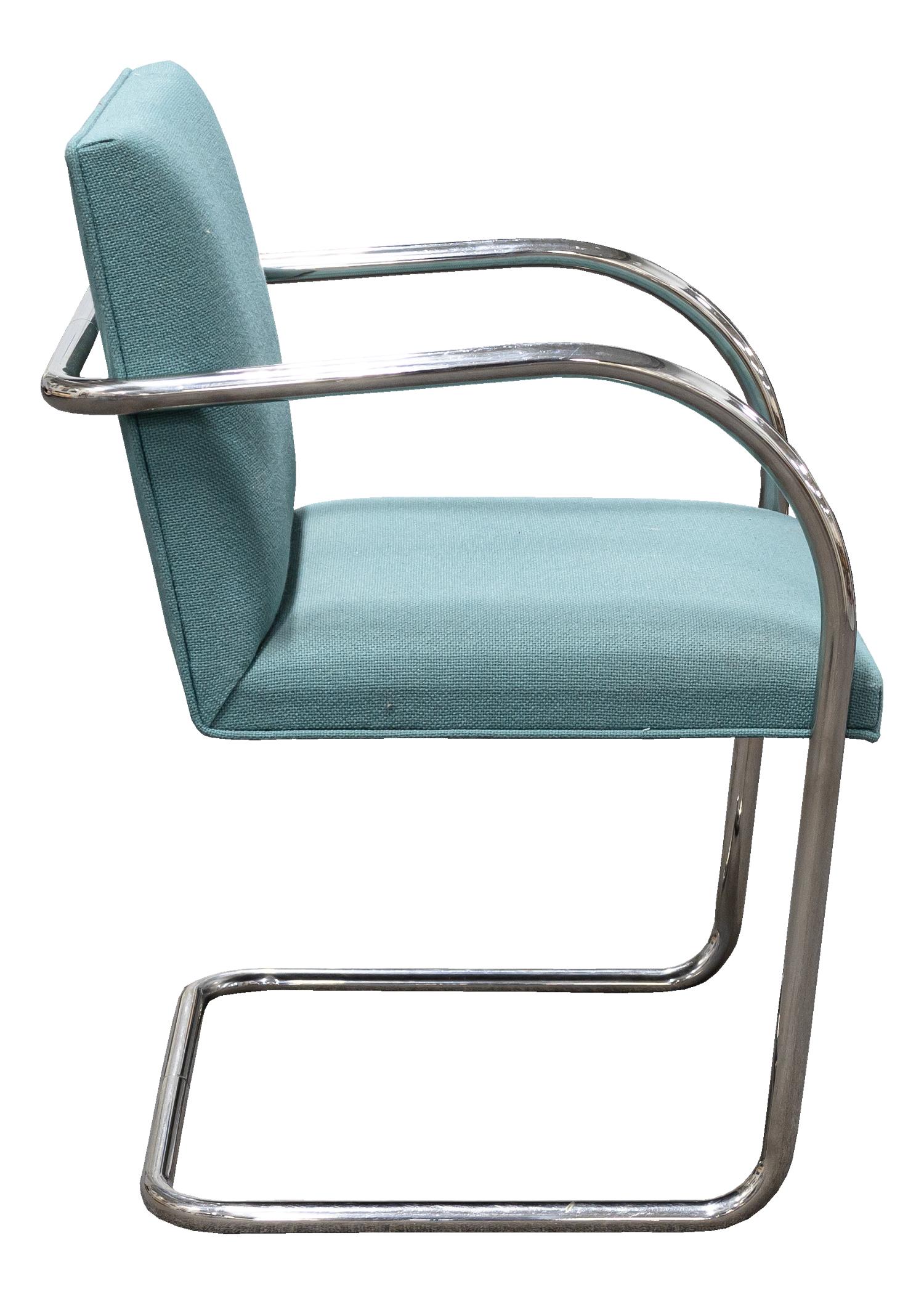 A marvelous modern set of 4 Thonet tubular steel cantilever chairs with light teal colored upholstery seating. Fabric is in very good condition and the teal color is perfect for modern interiors. Curved cantilever frame is iconic in mid-century