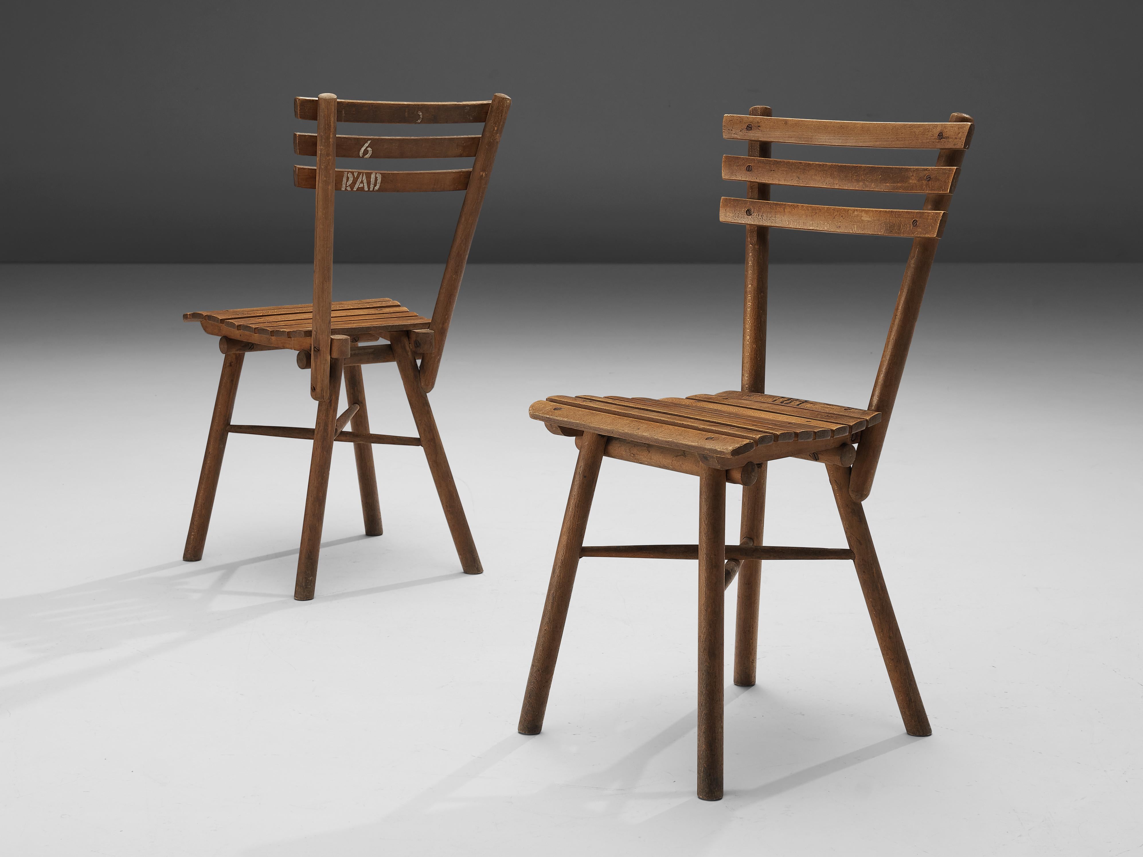 Thonet, side chairs, wood, Austria, 1950s

These for Thonet unusual chairs don’t feature the usual bentwood. Instead, they are made of separate parts. Seat and backrest are not upholstered but have a rhythmic construction of parallel wood slats.