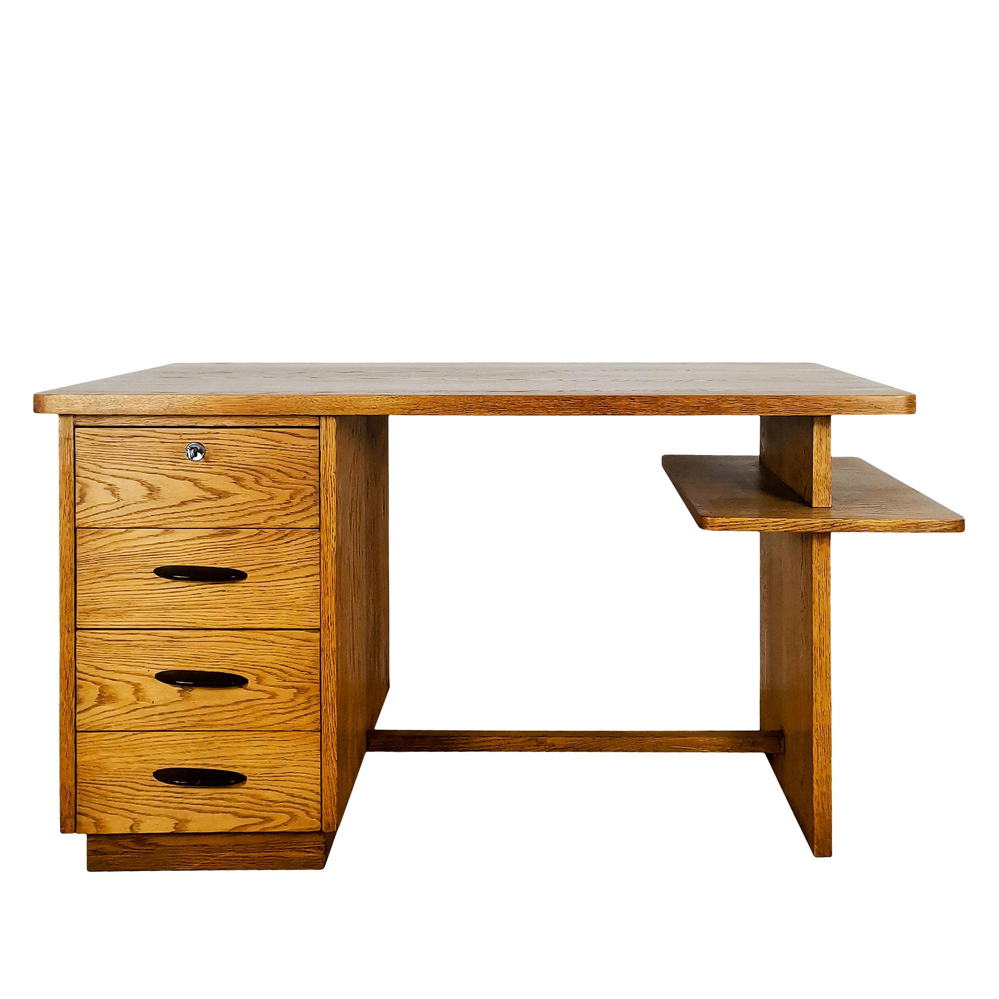 Small desk in double-sided solid light oak with four drawers, bakelite handles, nickel-plated metal keyhole and key. Satin shellac and wax finish.

Maison Thonet c.1930-40.