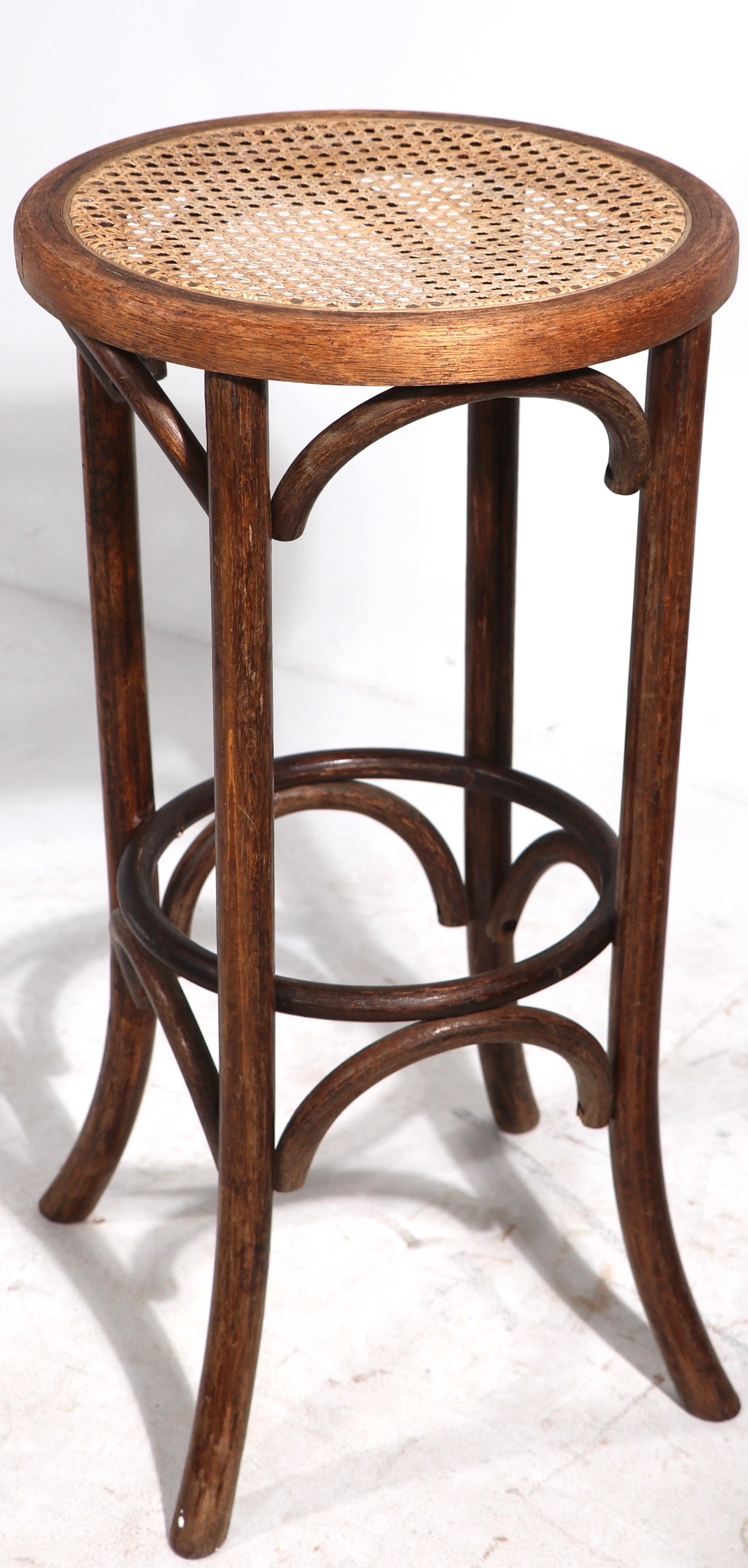 Vienna Secessionist school steam bentwood bar stool with cane seat. This antique example is in very good condition, solid, sturdy, clean and ready to use. Attributed to Thonet, unsigned.