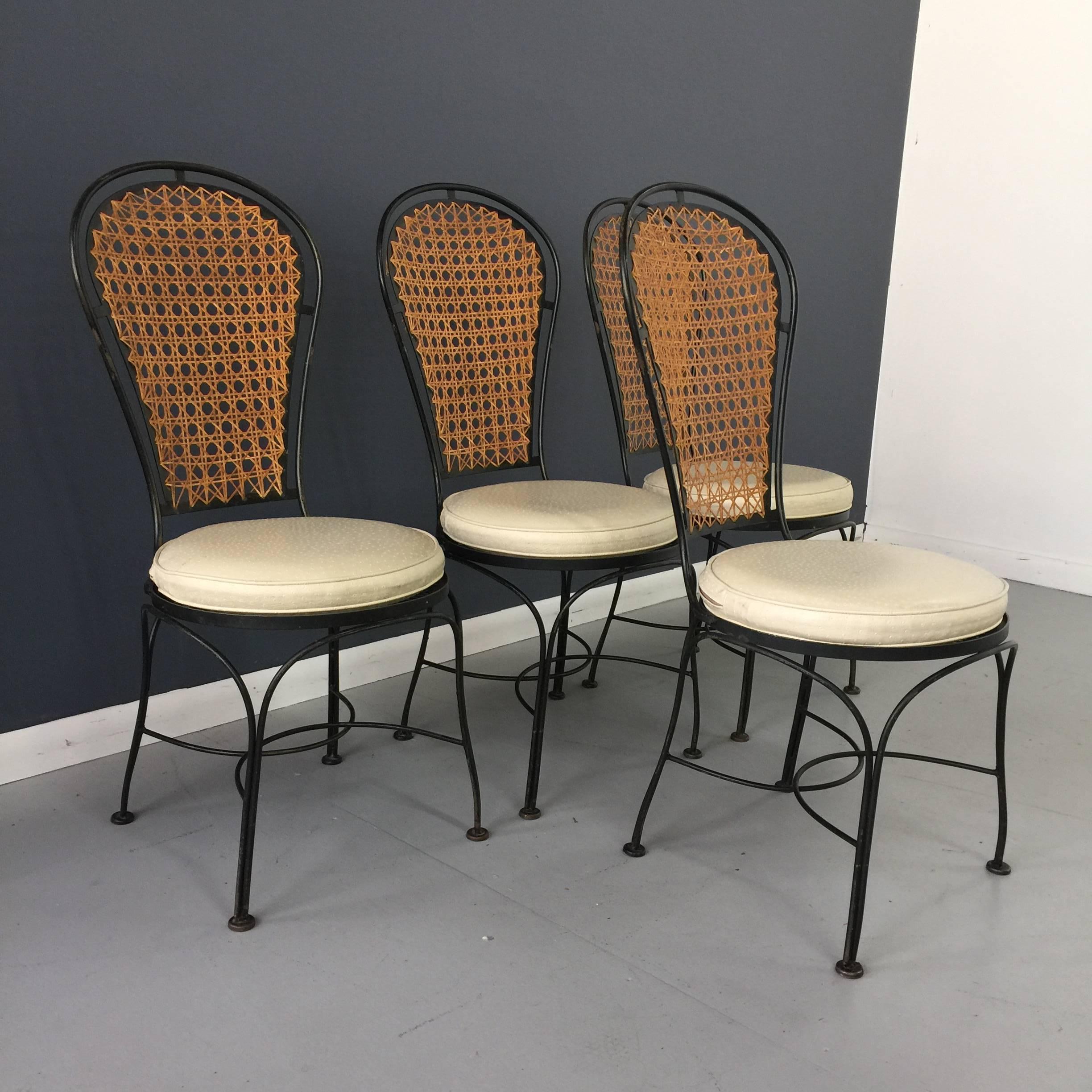 These lovely chairs are reminiscent of Thonet chairs. Caned backs in great condition. Metal shoes light oxidation. Original removable seat cushions are faux ostrich and do show some wear. Perfectly comfortable without cushions! Seats are 17 high