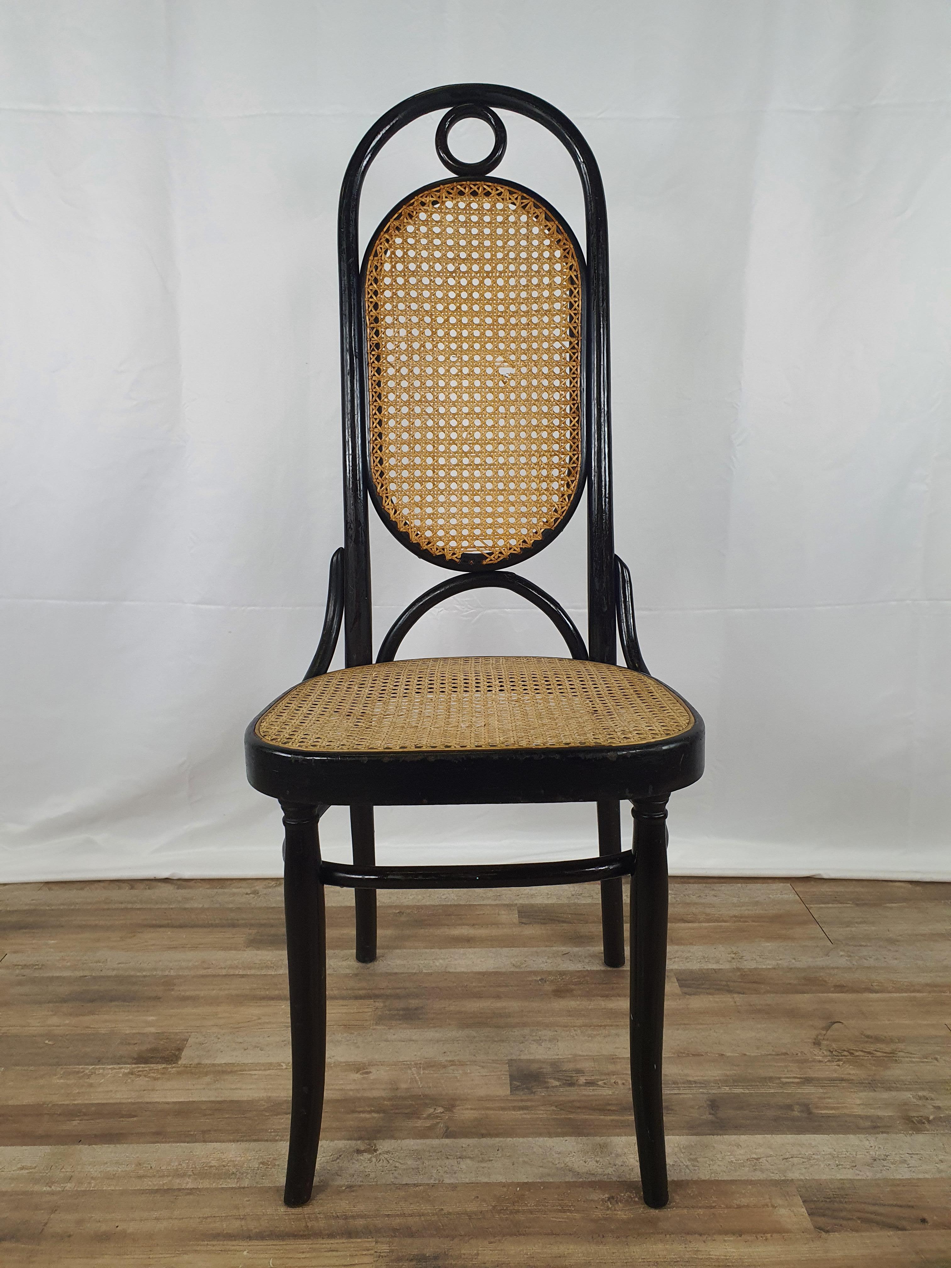 1960s Thonet style chair model n.17, also called 'Cathedral', black lacquered with original period Vienna straw seat and back.

Under the seat it says 