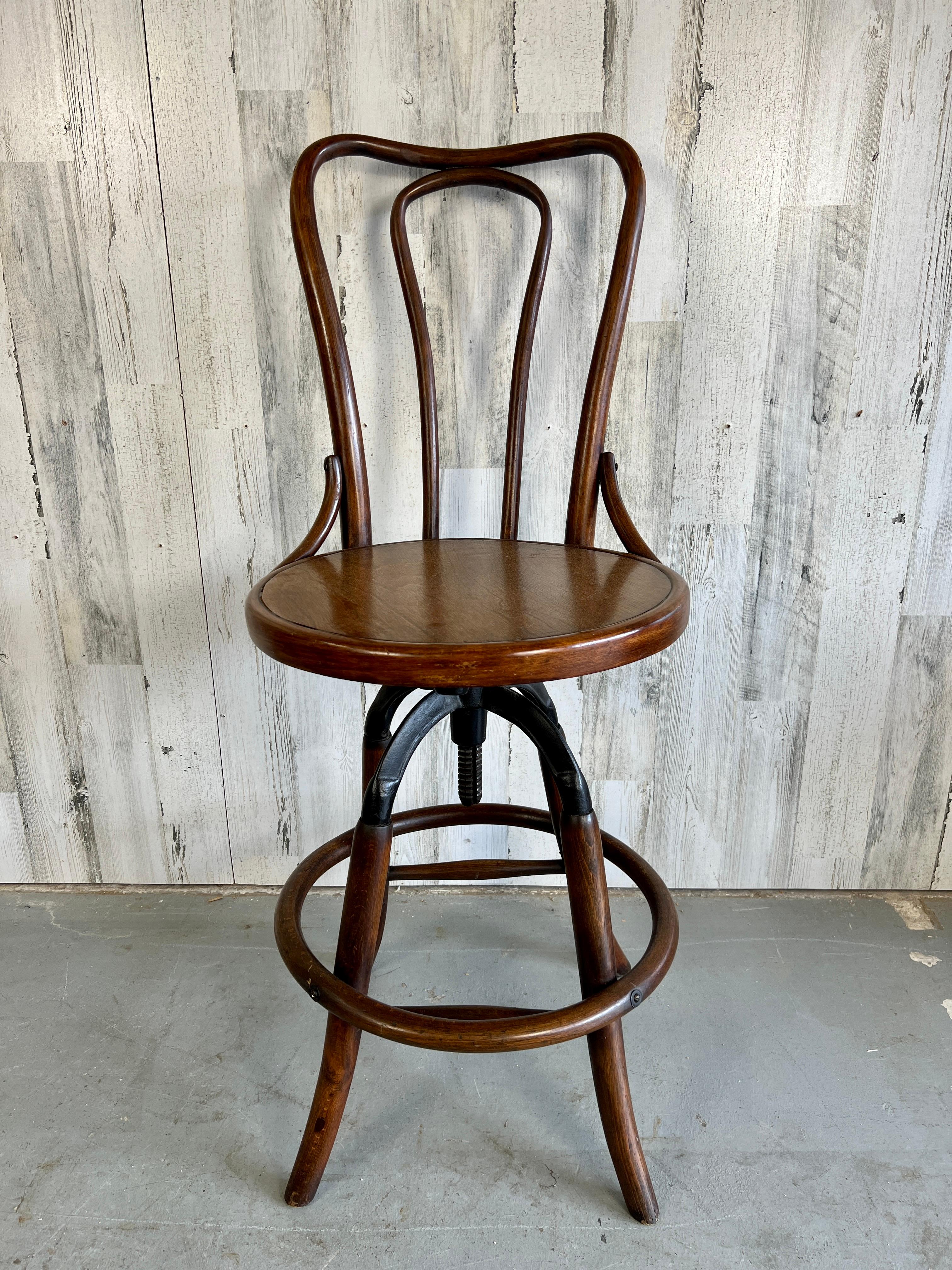 Nice combination of bentwood and cast iron that make this stool unusual style very pleasing to the eye. 
 