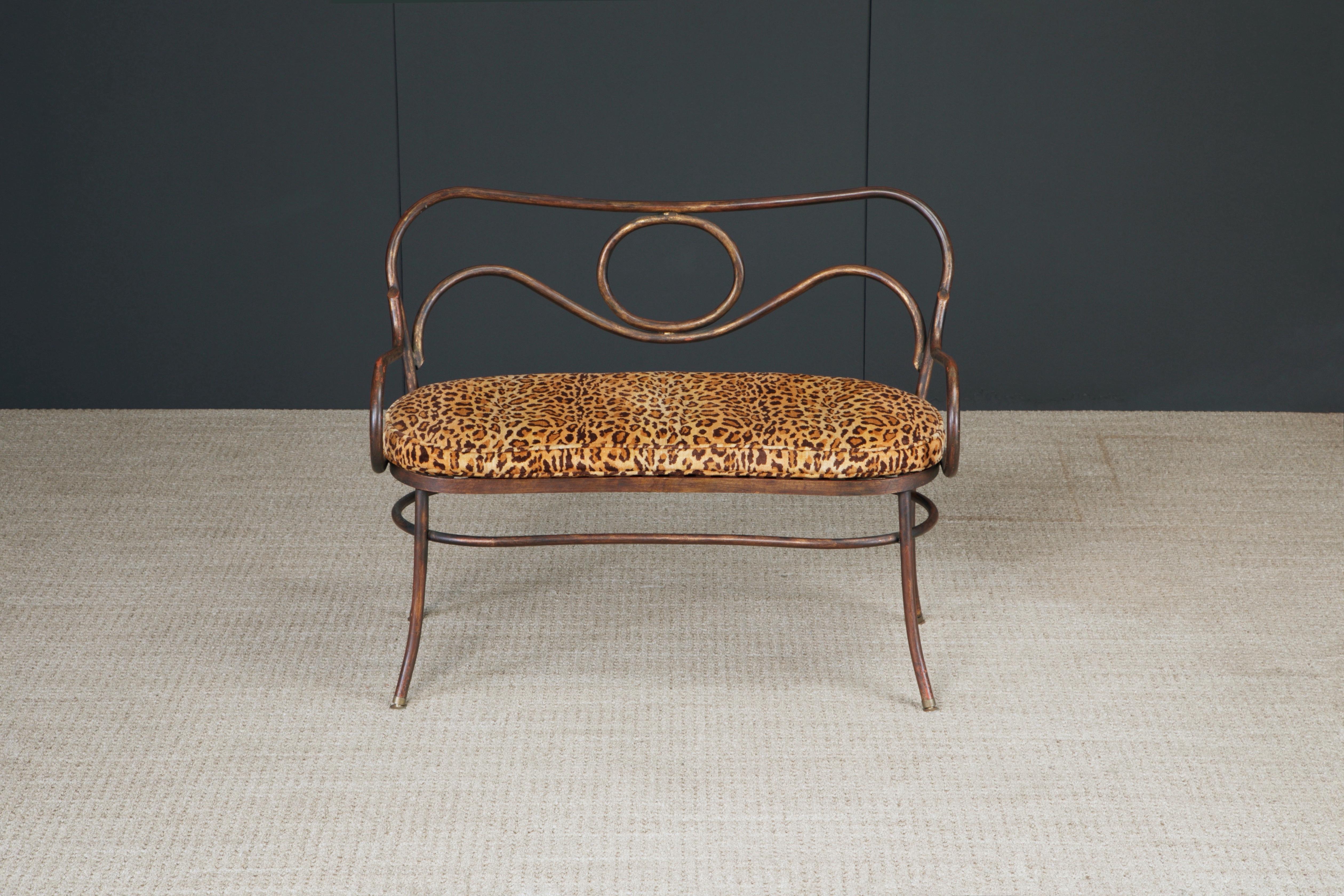 An intriguing patinated bronze settee in the style of Thonet's bentwood seating with leopard print fabric. Believed to be mid to late 20th Century, fabric newer. Very hefty and high quality piece. Suitable for outdoors with new seat cushion and