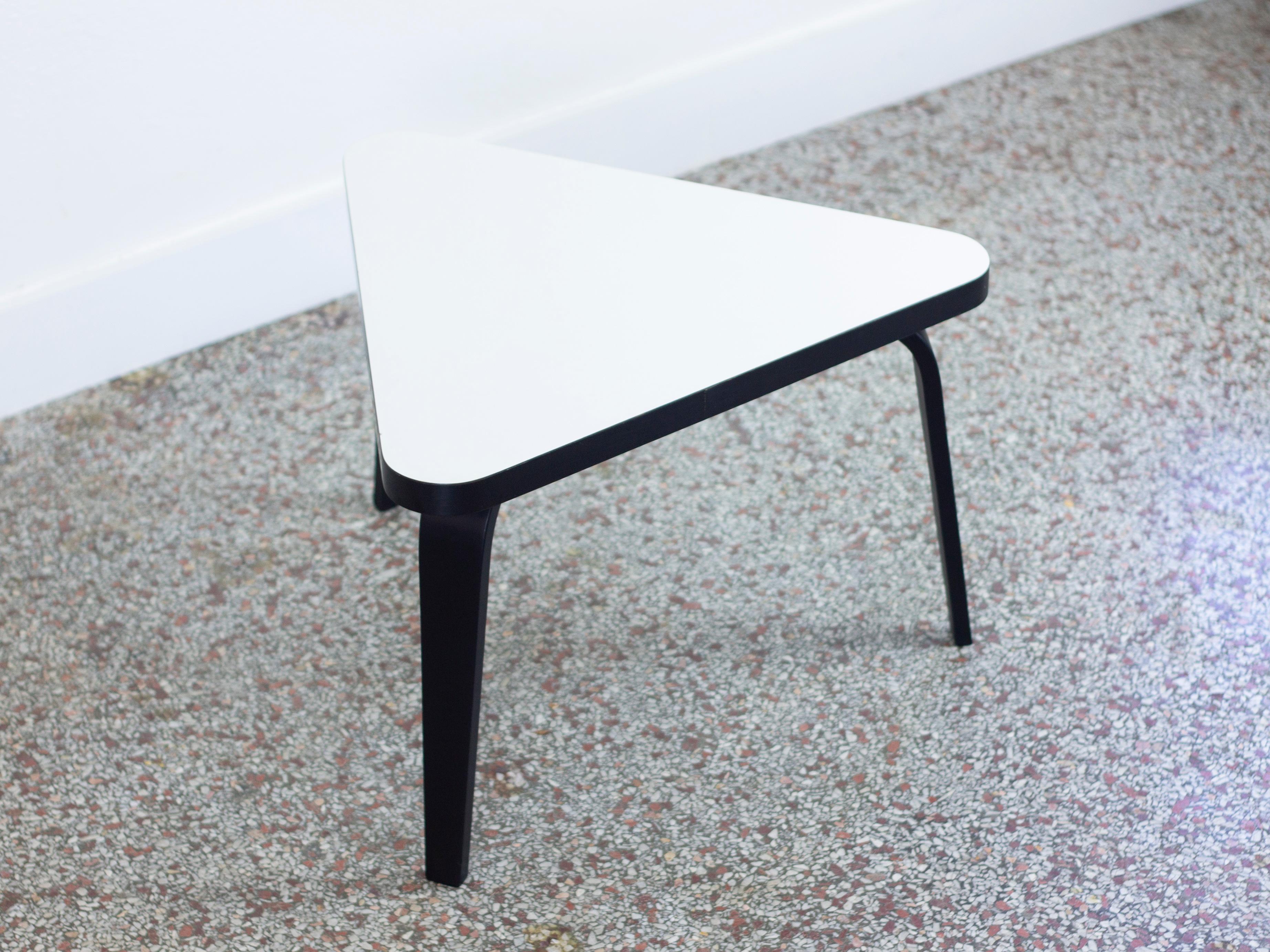 Vintage Mid-Century Modern triangular side table with white laminate top and black bentwood legs by Thonet.