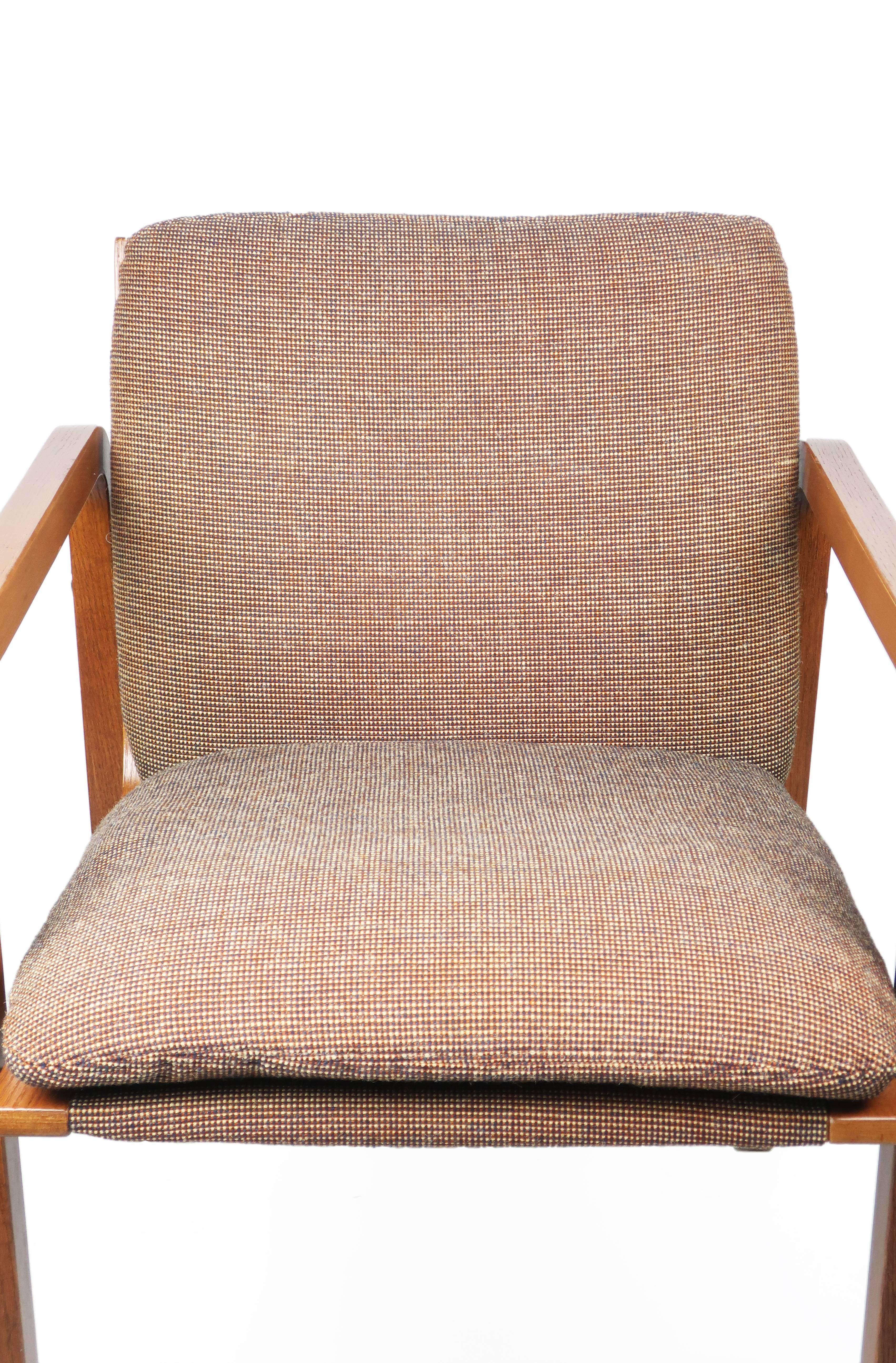 A Mid-Century Modern upholstered bentwood armchair by Thonet. Retains the original light brown wool upholstery on a beautiful oak frame with chrome accents. 

Seat cushion was recently reinforced to ensure many more years of comfortable sitting!