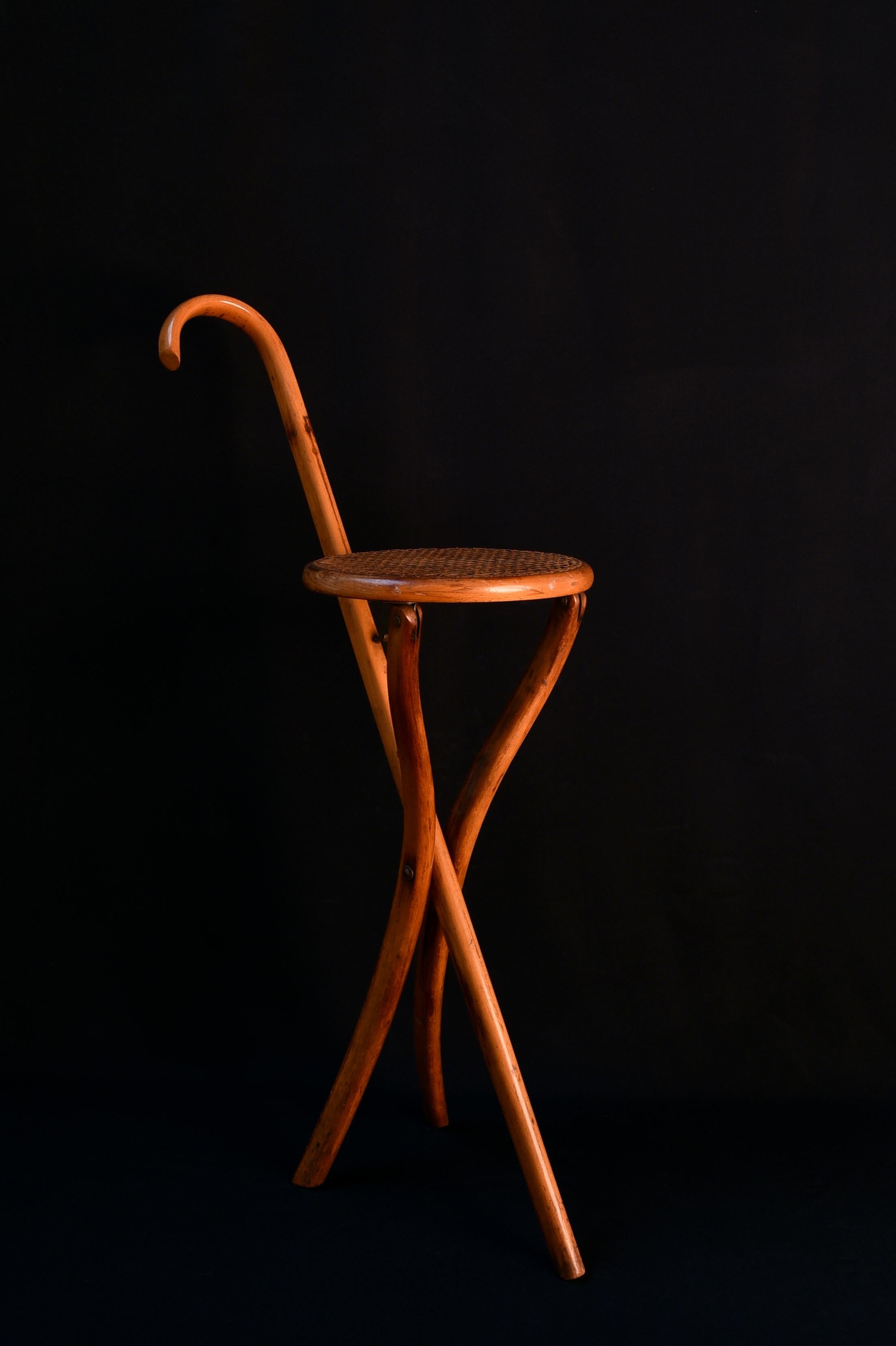 Victorian bentwood folding walking stick stool by the Austrian makers Thonet. With its swans neck handle and circular caned seat, this elegant example of the Thonet family was designed in 1866. 
 