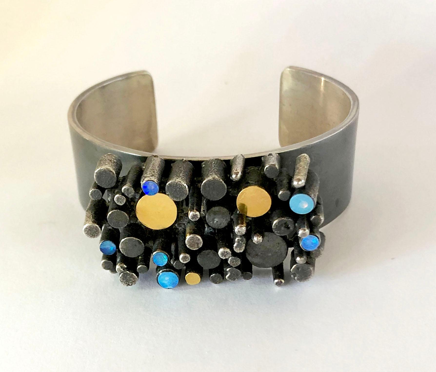 Oxidized sterling silver, gilt and opal bracelet created by Danish modern jeweler, Thor Selzer, circa 1960s.  Bracelet measures 7