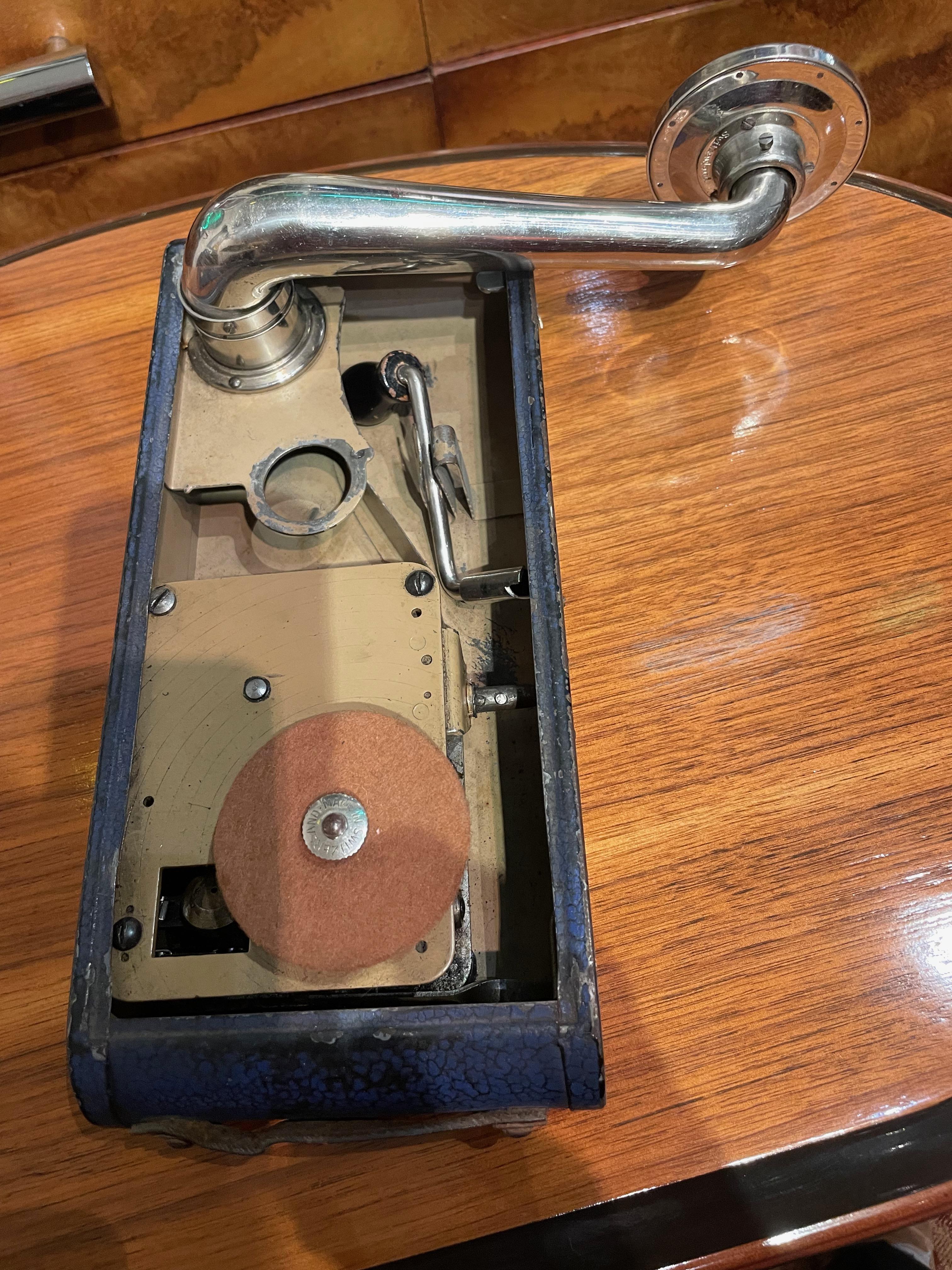 This is an authentic Excelda portable gramophone, the portable phonograph of the 1930's that resembled the pocket cameras of that time (usually referred to as a “Cameraphone”). It was made by Thorens, the famous Swiss manufacturer of gramophones,