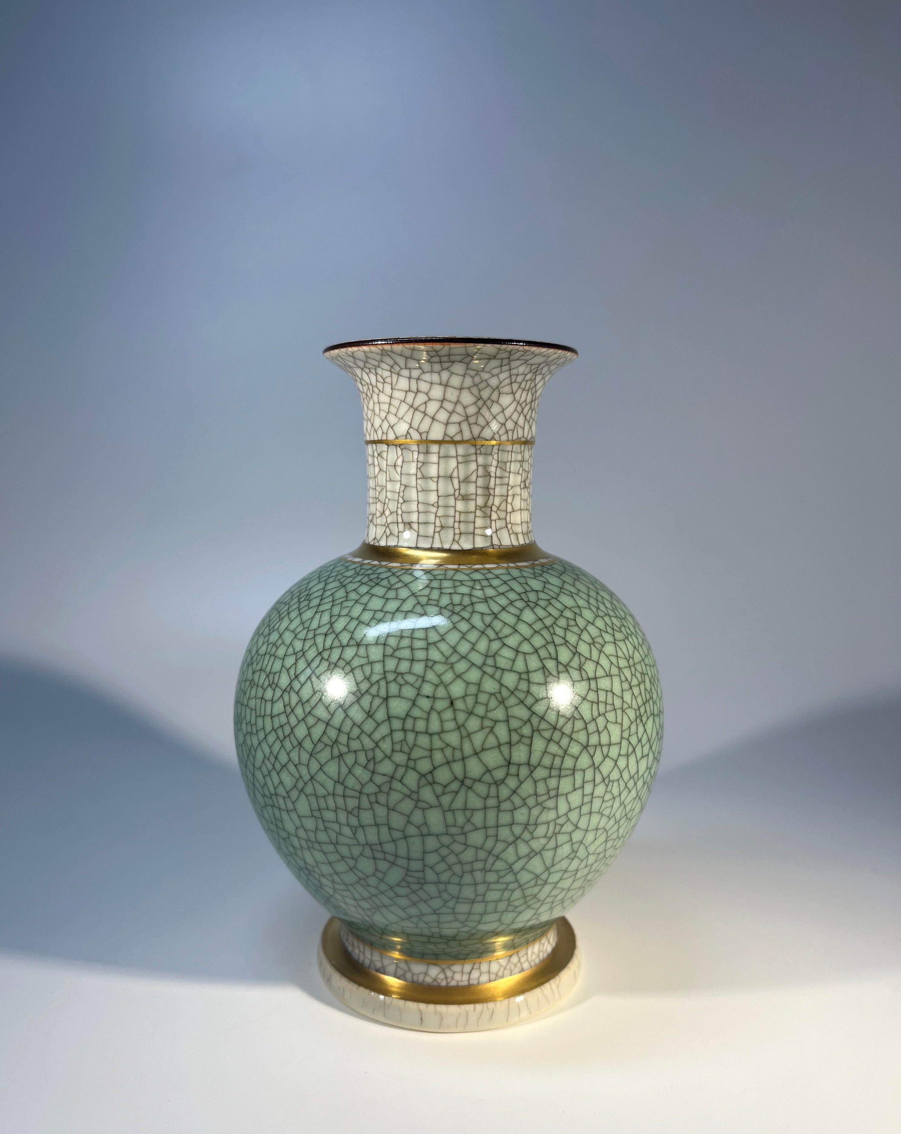 Thorkild Olsen for Royal Copenhagen, porcelain pale green and grey crackle glazed ball shaped vase with gilded banding on neck and base.
Circa 1958
Stamped and numbered 3033
Height 5.5 inch, Diameter 3.75 inch
In excellent condition
Wear consistent
