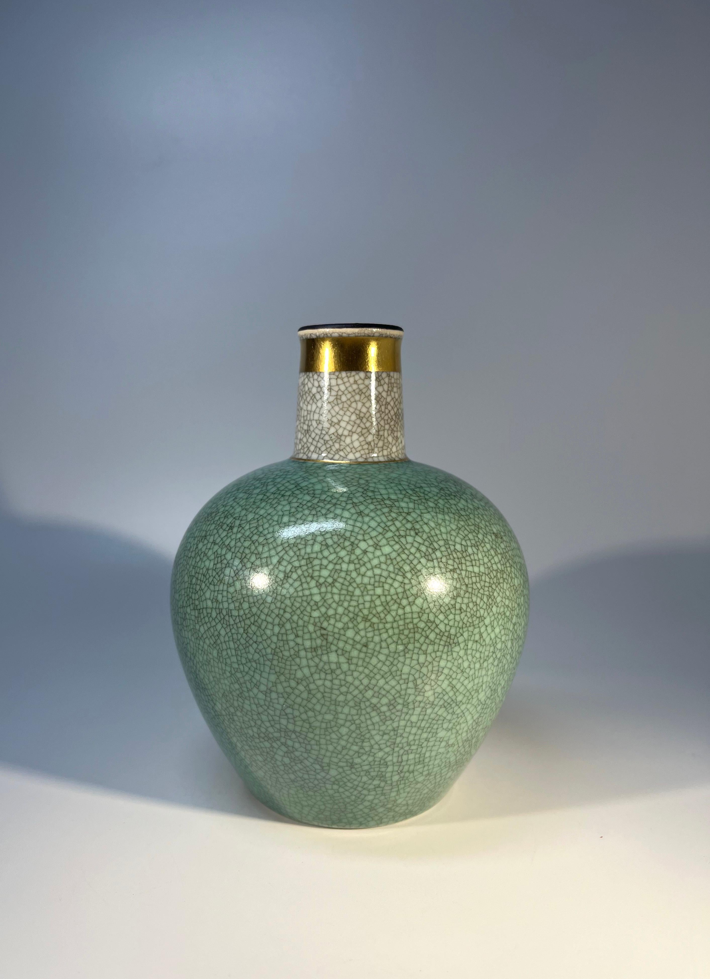 Thorkild Olsen for Royal Copenhagen, porcelain pale green and grey crackle glazed vase with gilded banding on neck
Understated elegance from Denmark
Circa 1968
Stamped and numbered 3582
Height 5.5 inch, Diameter 4.5 inch
In excellent condition.
Wear